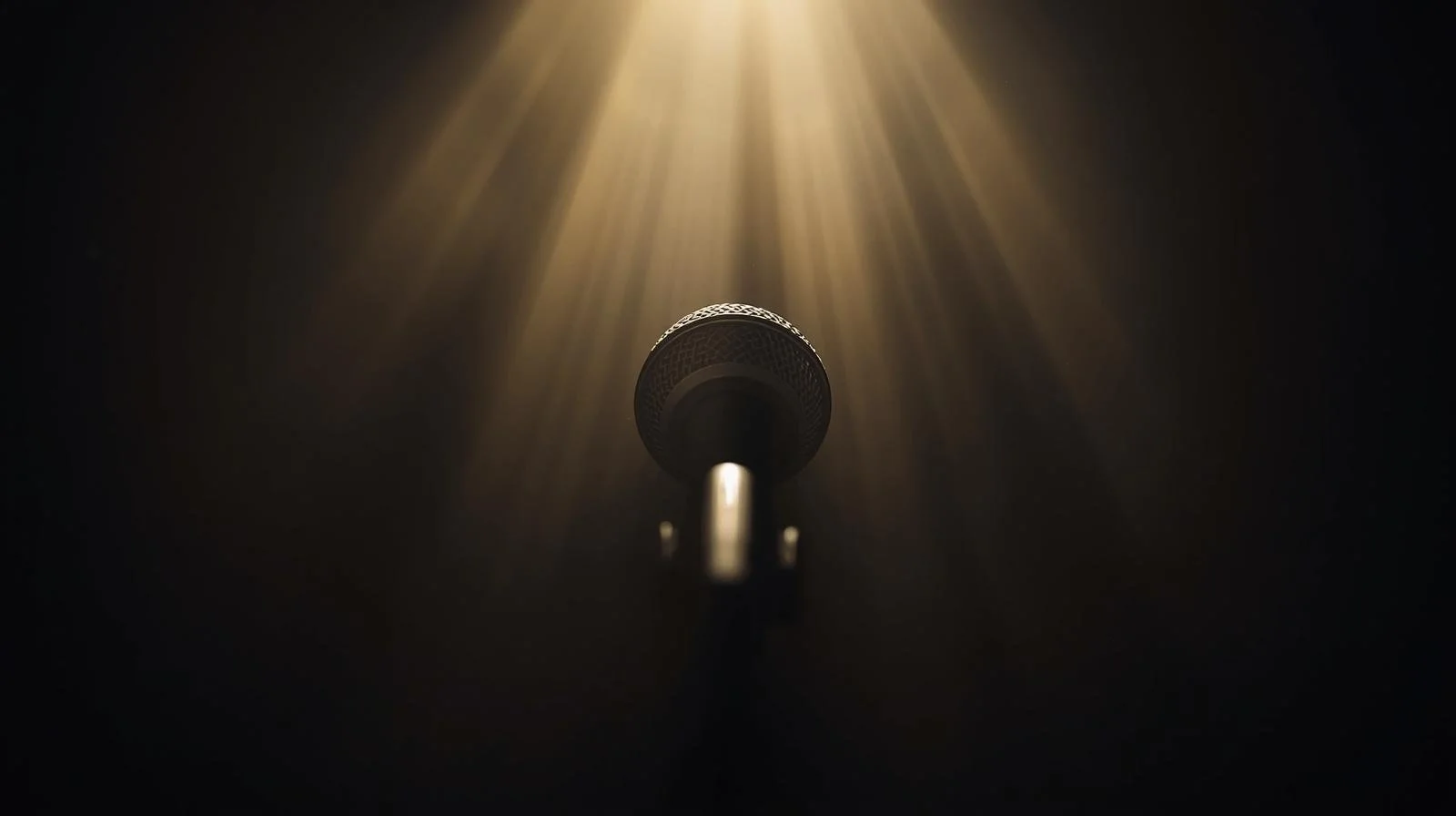 A microhone with a ray of light shining on it