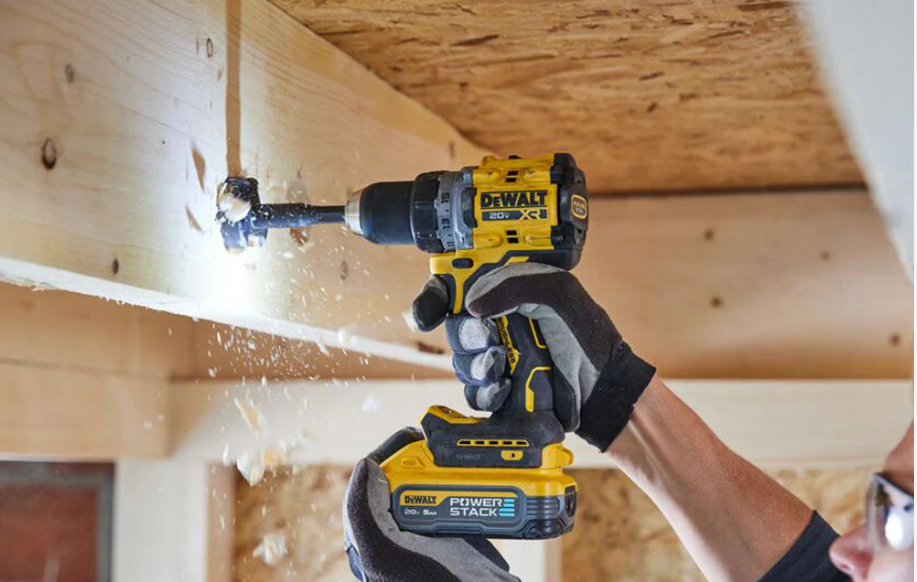 Handyman drilling into wood for installation — Orange County, CA