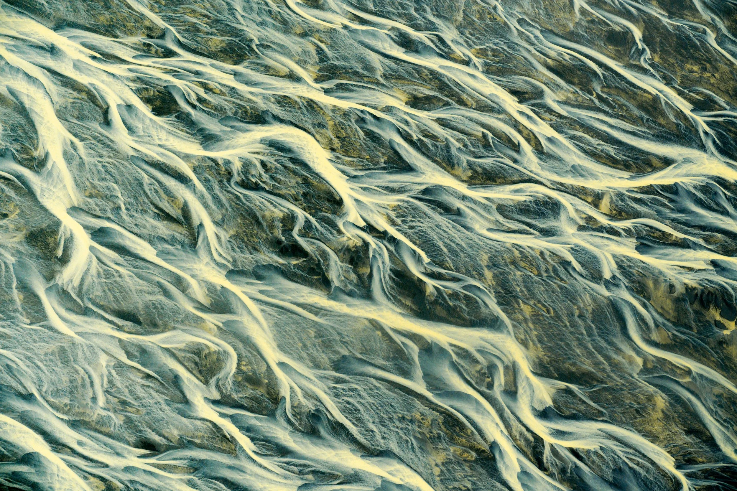 Glacial River Running Over Black Sand