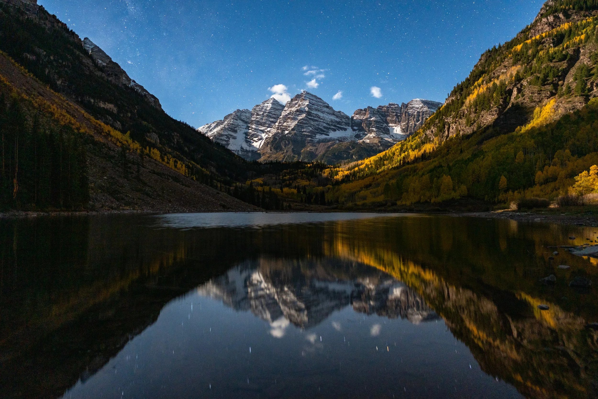 The Maroon Bells
Colorado’s iconic twin peaks, captured in a moment of absolute stillness at the edge of Maroon Lake just before moonrise.