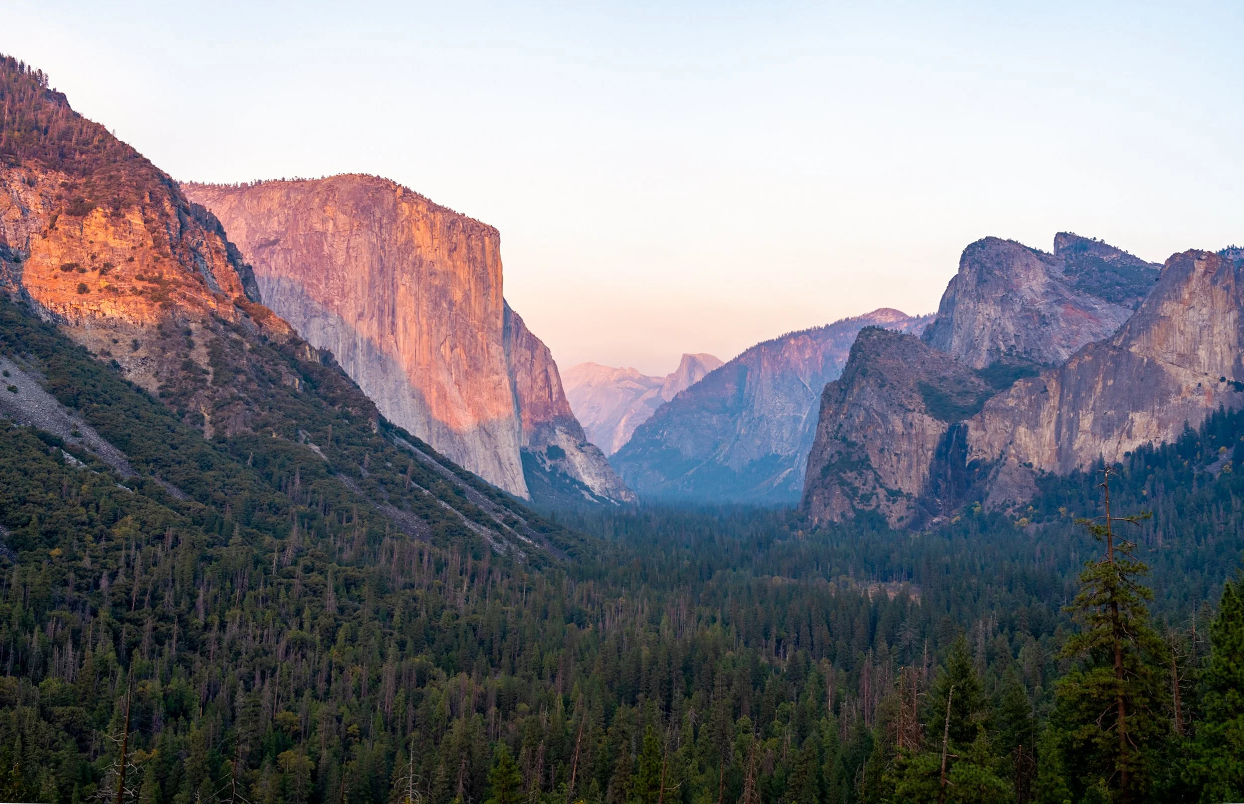 Dawn Over the Valley
classic view of Yosemite’s most famous landmarks bathed in the soft glow of sunrise.