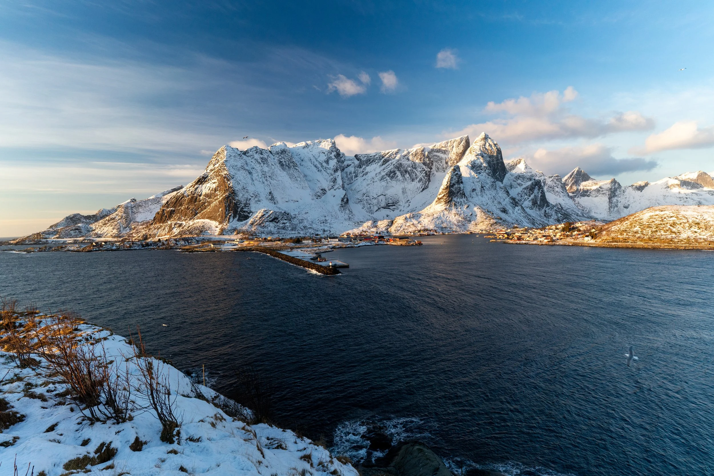 Reinebringen View
Looking down from the steep cliffs of Reine onto the red fishing huts and deep blue fjords of Lofoten.