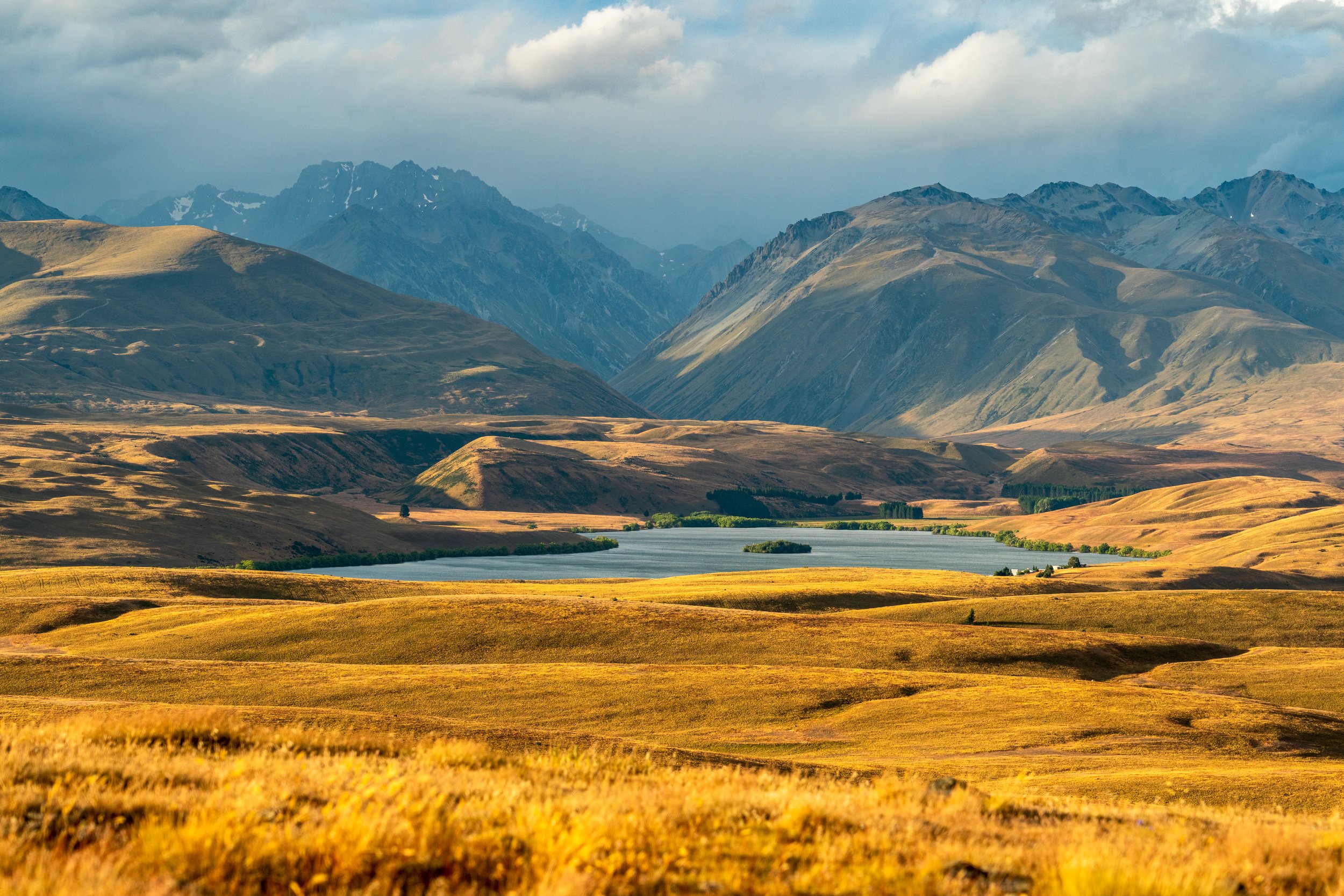 The Hopkins Valley 
A vast, cinematic perspective of the golden high country surrounding Lake Ohau, New Zealand.