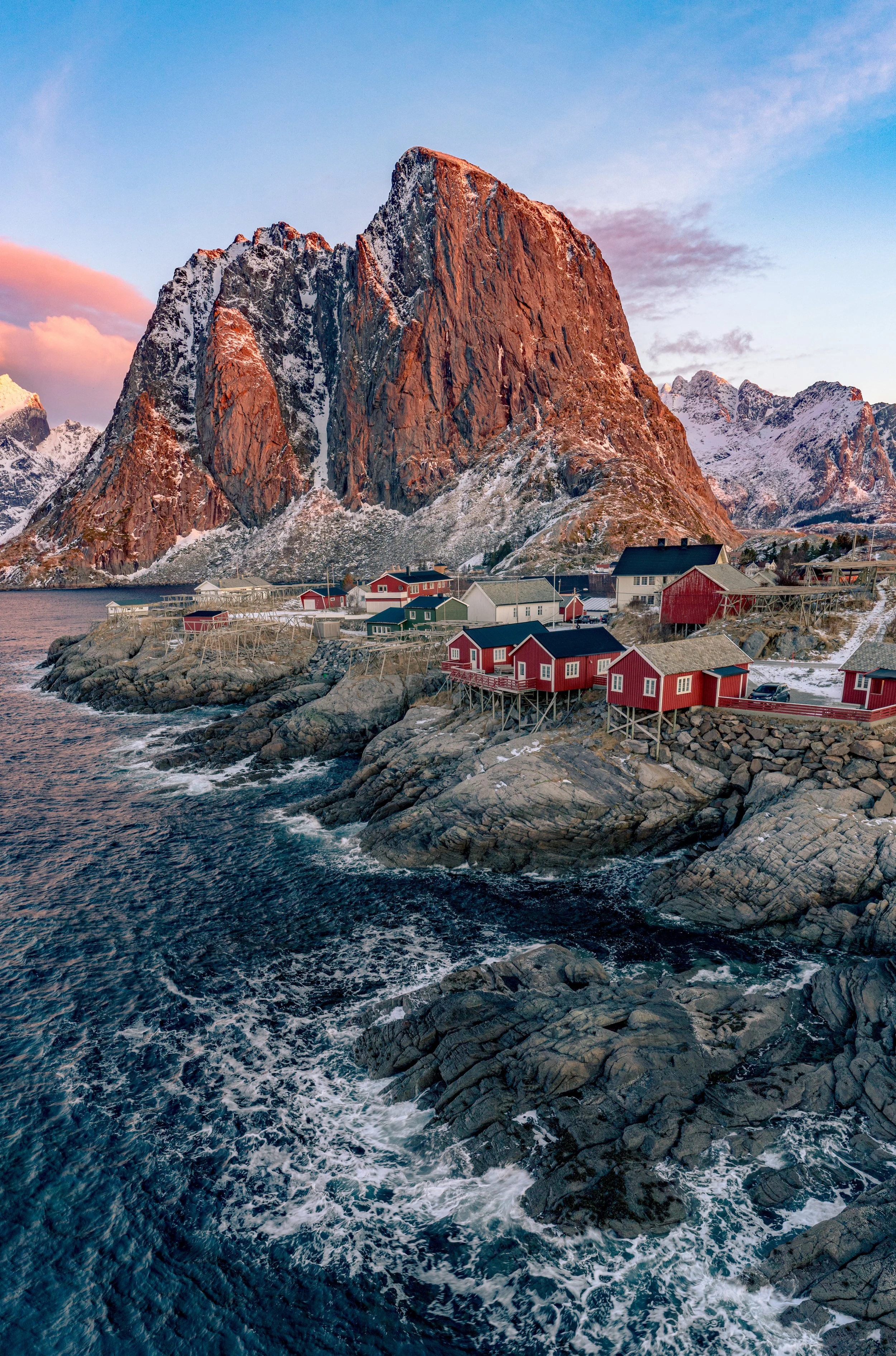 A Arctic Haven
A vibrant cluster of rorbu—traditional 
Norwegian fishing cabins—tucked at the base of the massive granite peaks of the Lofoten archipelago. Originally used as seasonal housing for fishermen during the grueling winter cod season, these