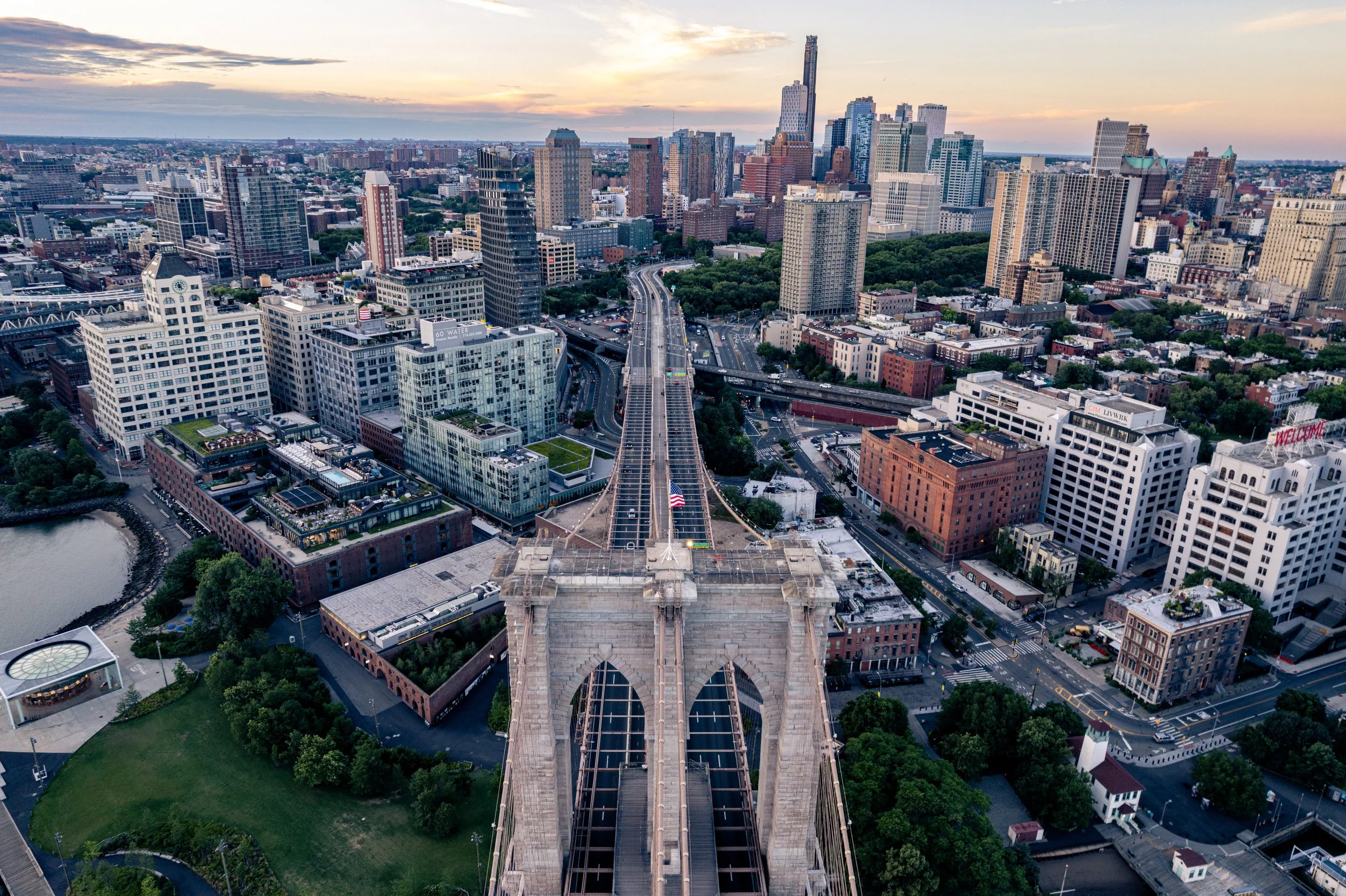 Brooklyn View
A view of the Brooklyn Bridge looking back toward the Brooklyn skyline. This shot highlights the intricate network of suspension cables as they converge toward the granite towers, with the historic waterfront of Brooklyn Heights visible