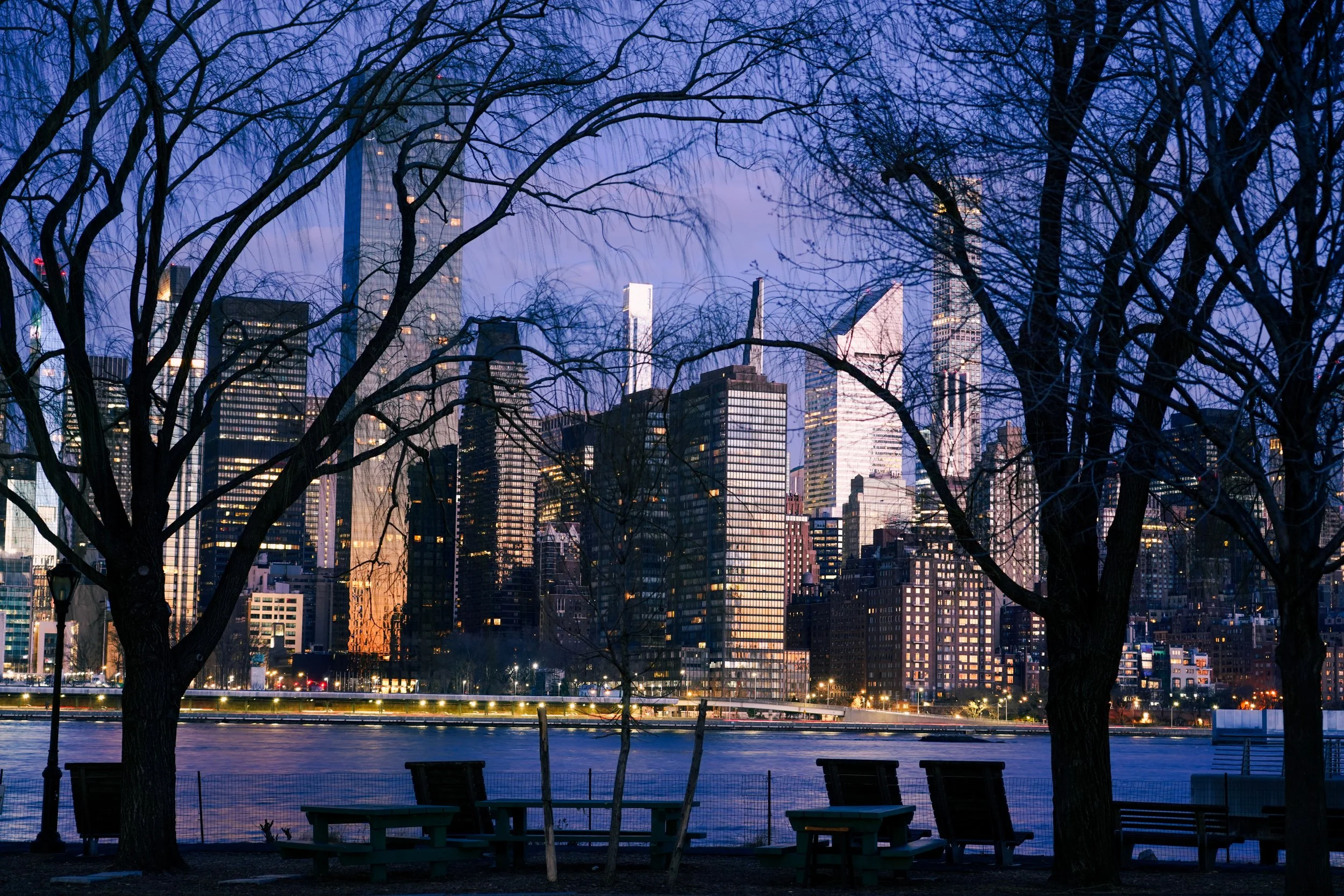 Dawn at Gantry Plaza
The first light of day breaks over the East River, illuminating the historic gantries of Gantry Plaza State Park. This shot captures the calm, glass-like water reflecting the early morning sky, with the Midtown Manhattan skyline 