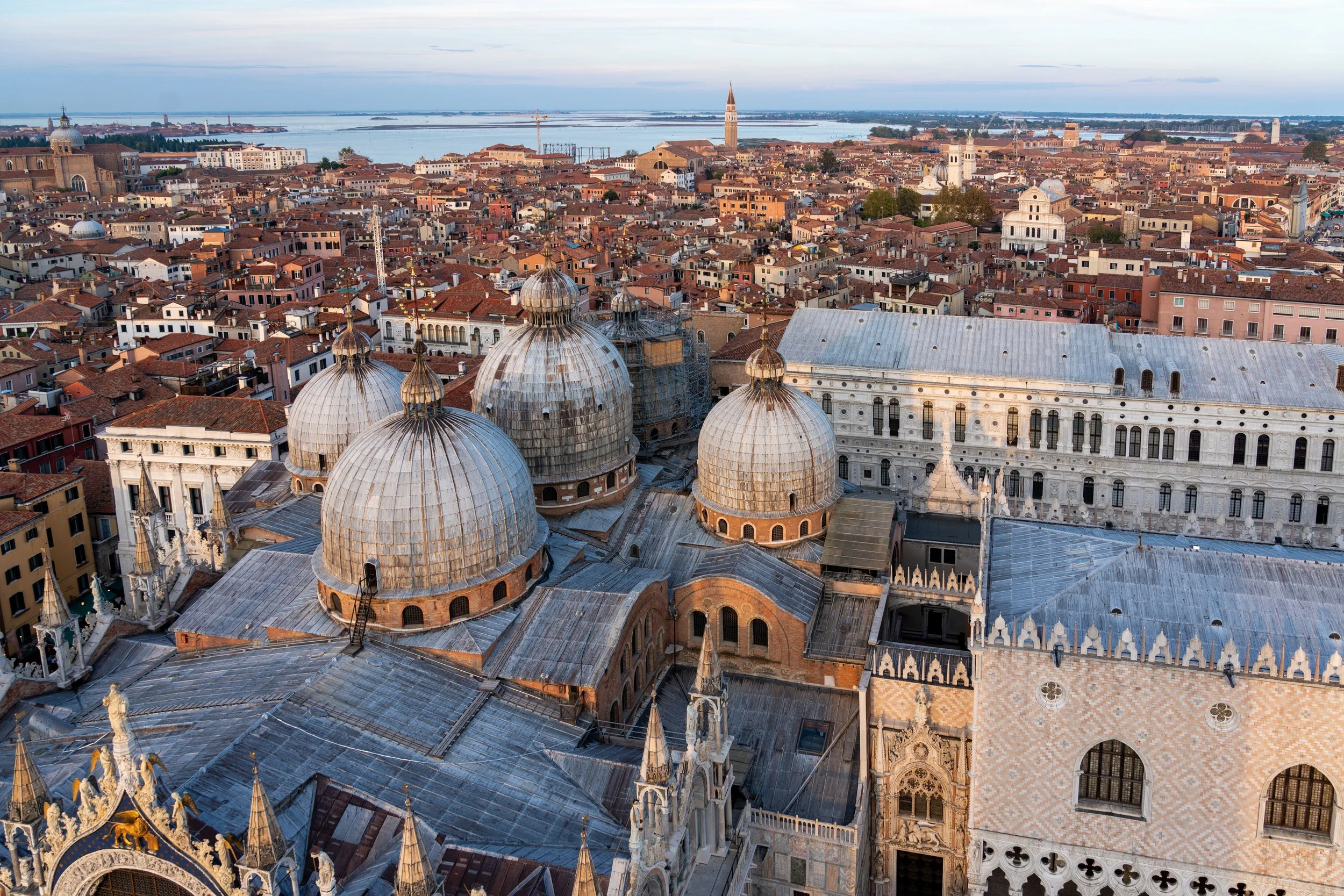 Florentine Dusk
A sweeping wide-angle view of Florence as the sun sets over the Arno River. The shot captures the warm, terracotta hues of the city’s rooftops and the historic bridges that span the water. With the Duomo anchoring the skyline, this pe