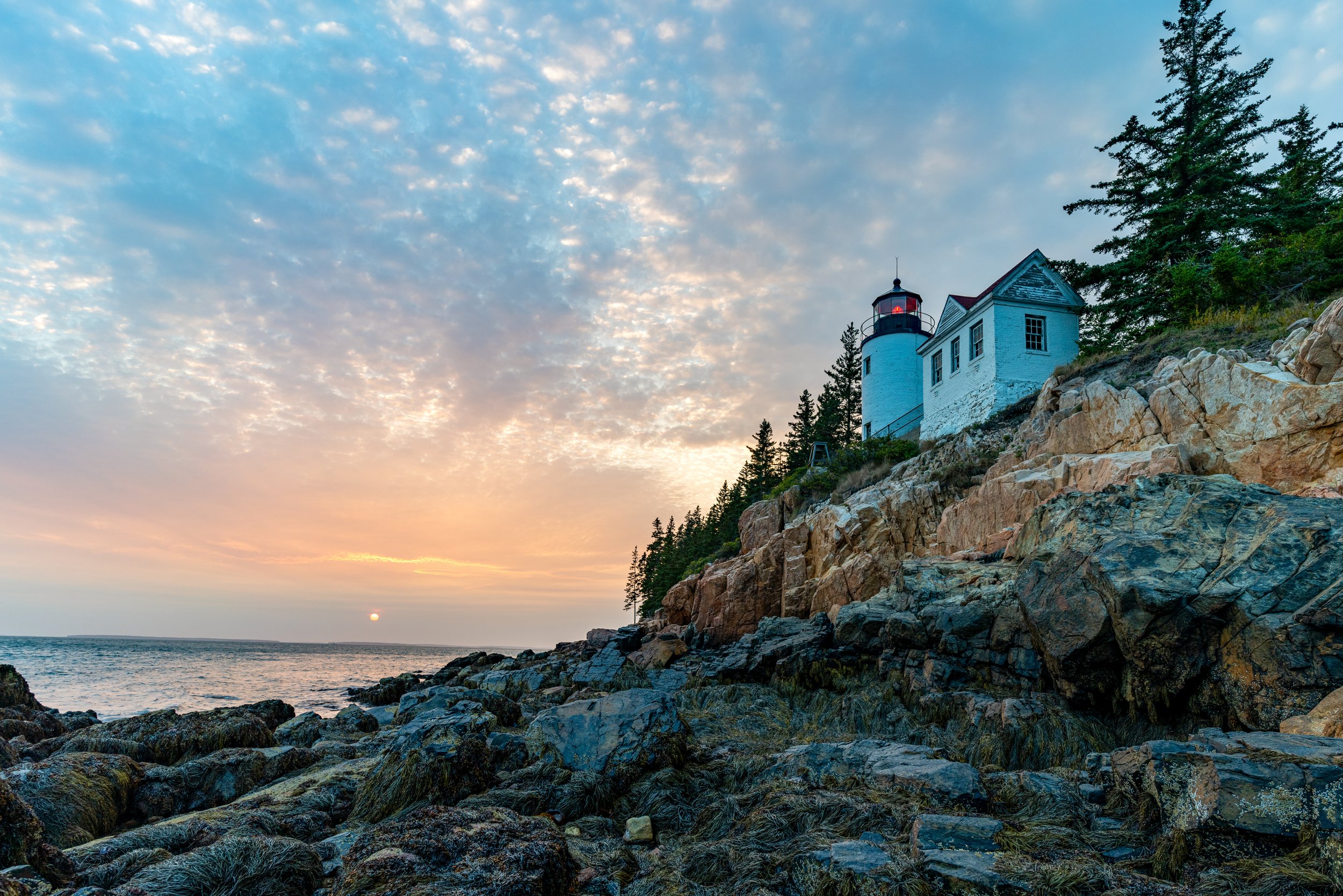 Acadia
Perched on a rugged granite cliff on the quiet side of Mount Desert Island, the Bass Harbor Head Light Station has guided mariners into Blue Hill Bay since 1858. This shot, taken from the rocky shoreline below the station, captures the 32-foot