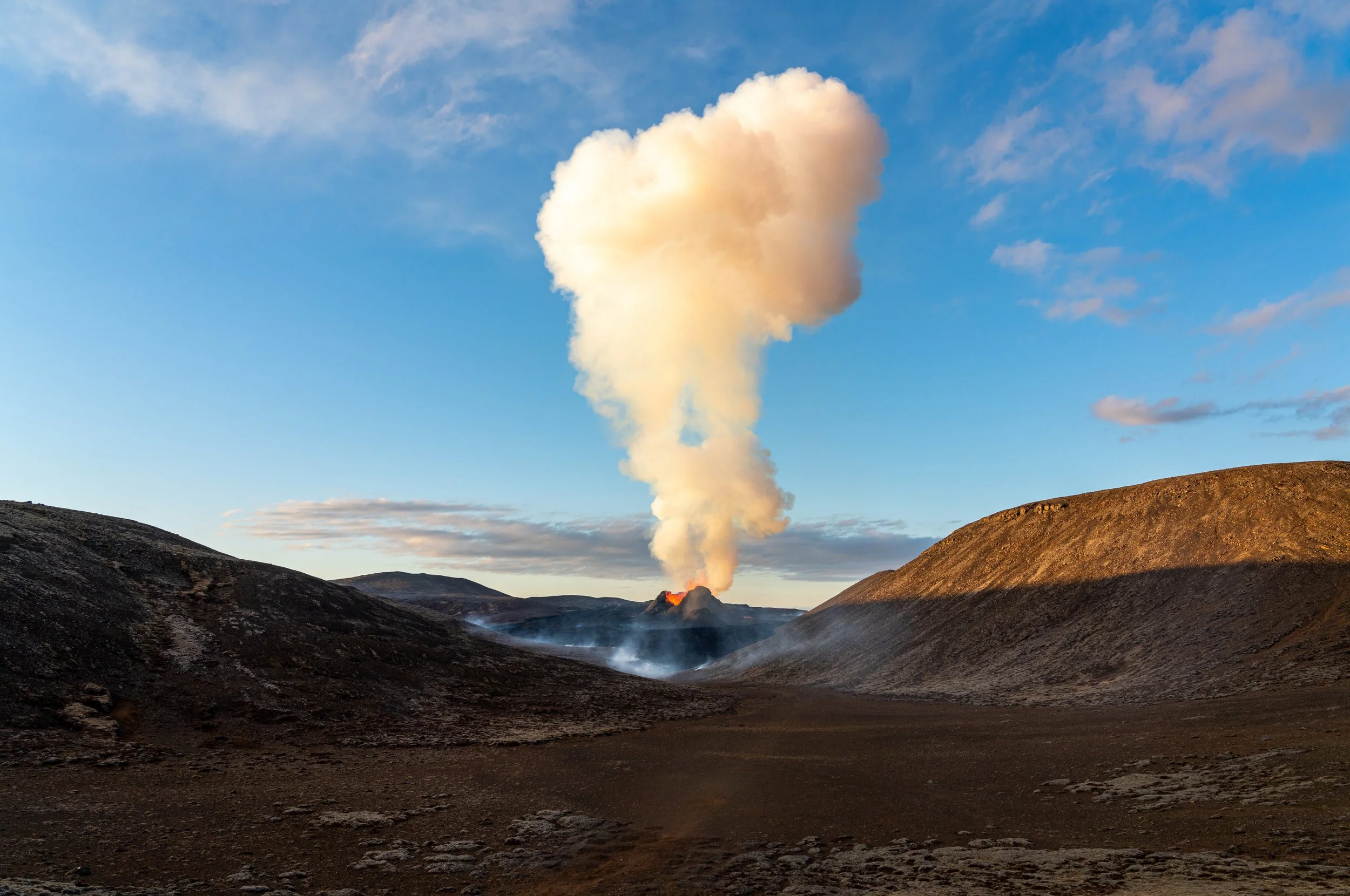 The Forge of Iceland
A massive plume of steam and volcanic gas towers over the main vent of Fagradalsfjall. This shot captures the peak of a fountaining episode, where liquid rock is propelled hundreds of feet into the air before feeding the vast lav