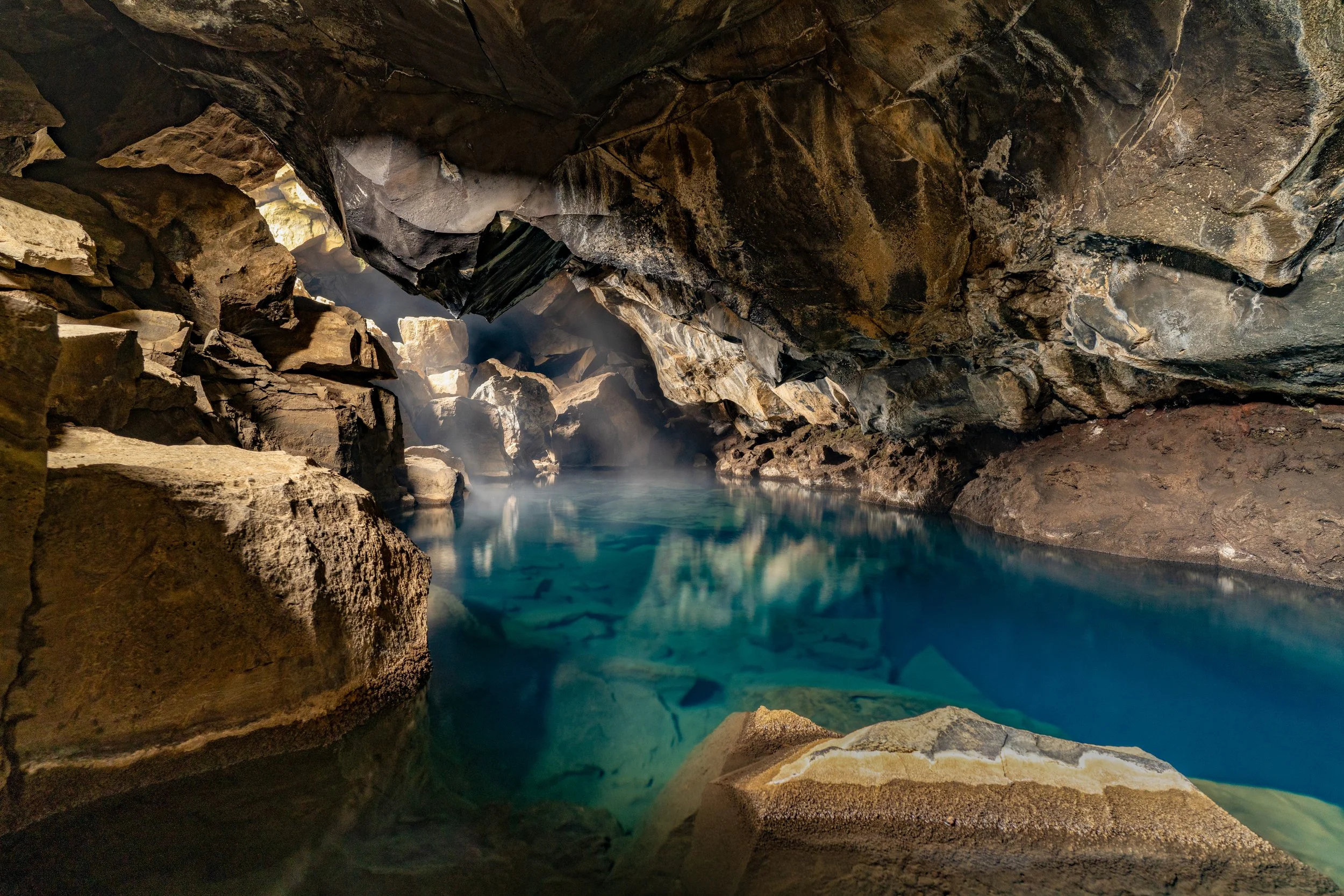 A Cave in Iceland
This hidden cave is a fissure in the earth's crust formed by volcanic activity. It has a geothermal hot spring that used to be an outlaw's hideout and later a local bathing spot.