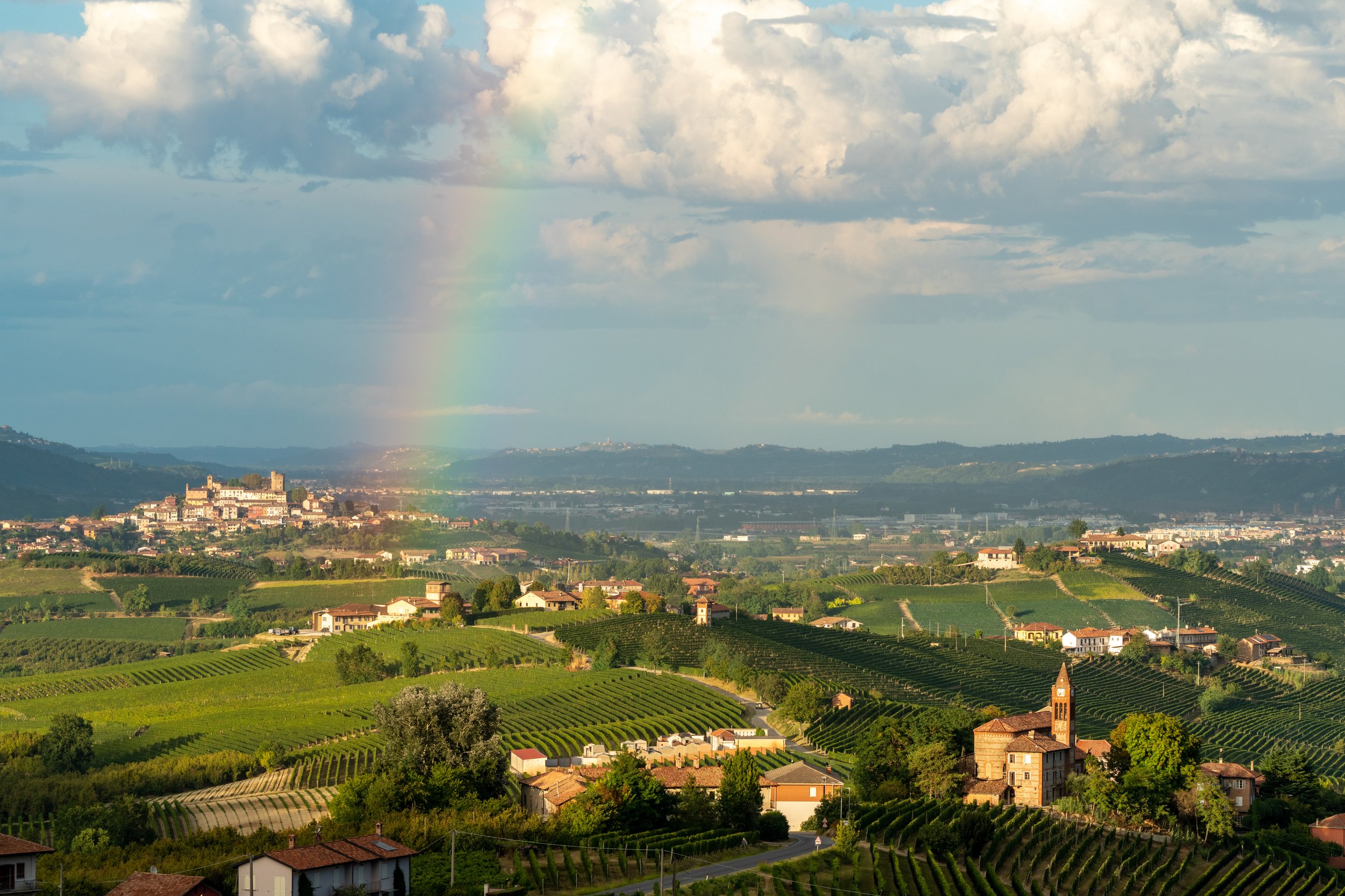 Covenant of the Piedmont
A vibrant rainbow arches over the rolling hills and historic stone villages of the Piedmont region. Captured during a break in an atmospheric storm, the light creates a stunning contrast between the dark, retreating clouds an