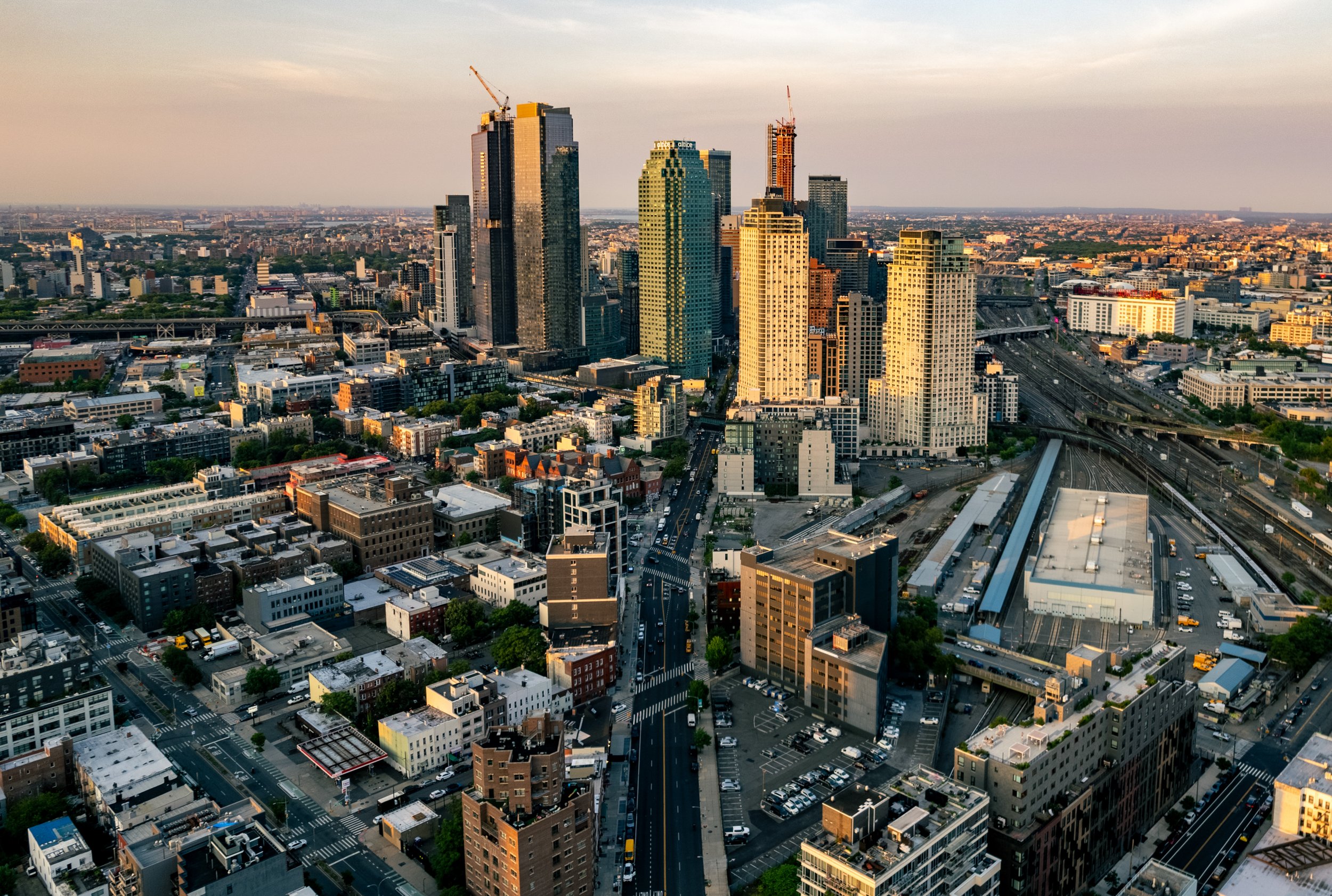 Queens Perspective
A sprawling aerial view of Long Island City, where the rapidly growing skyline of Queens meets the historic industrial waterfront. This shot highlights the dense cluster of new residential skyscrapers that have reshaped the borough