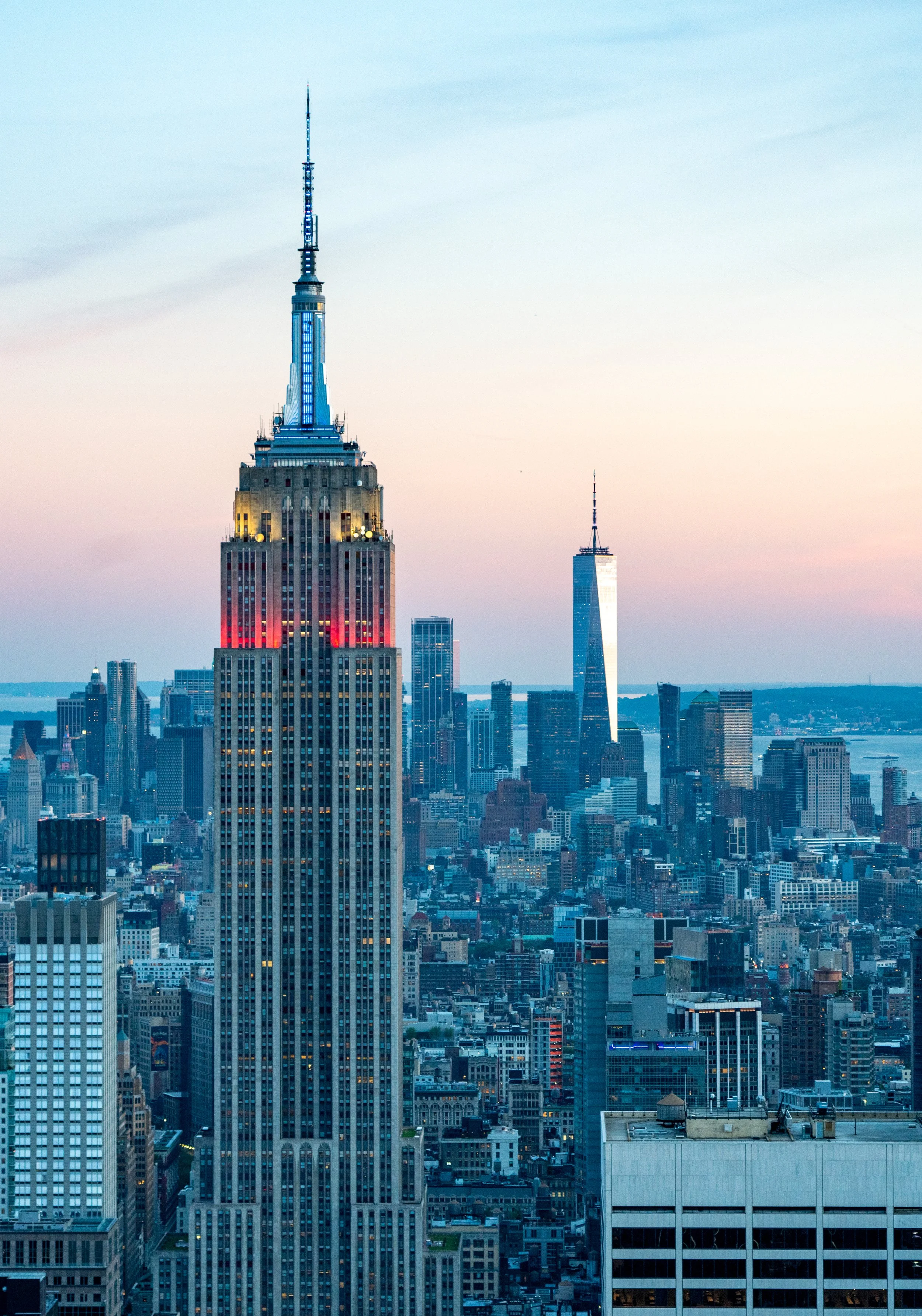 The King of Midtown
Looking south from the Top of the Rock, this shot captures the Empire State Building towering over the Midtown skyline. The Art Deco masterpiece is framed by the surrounding cityscape, with the One World Trade Center rising in the