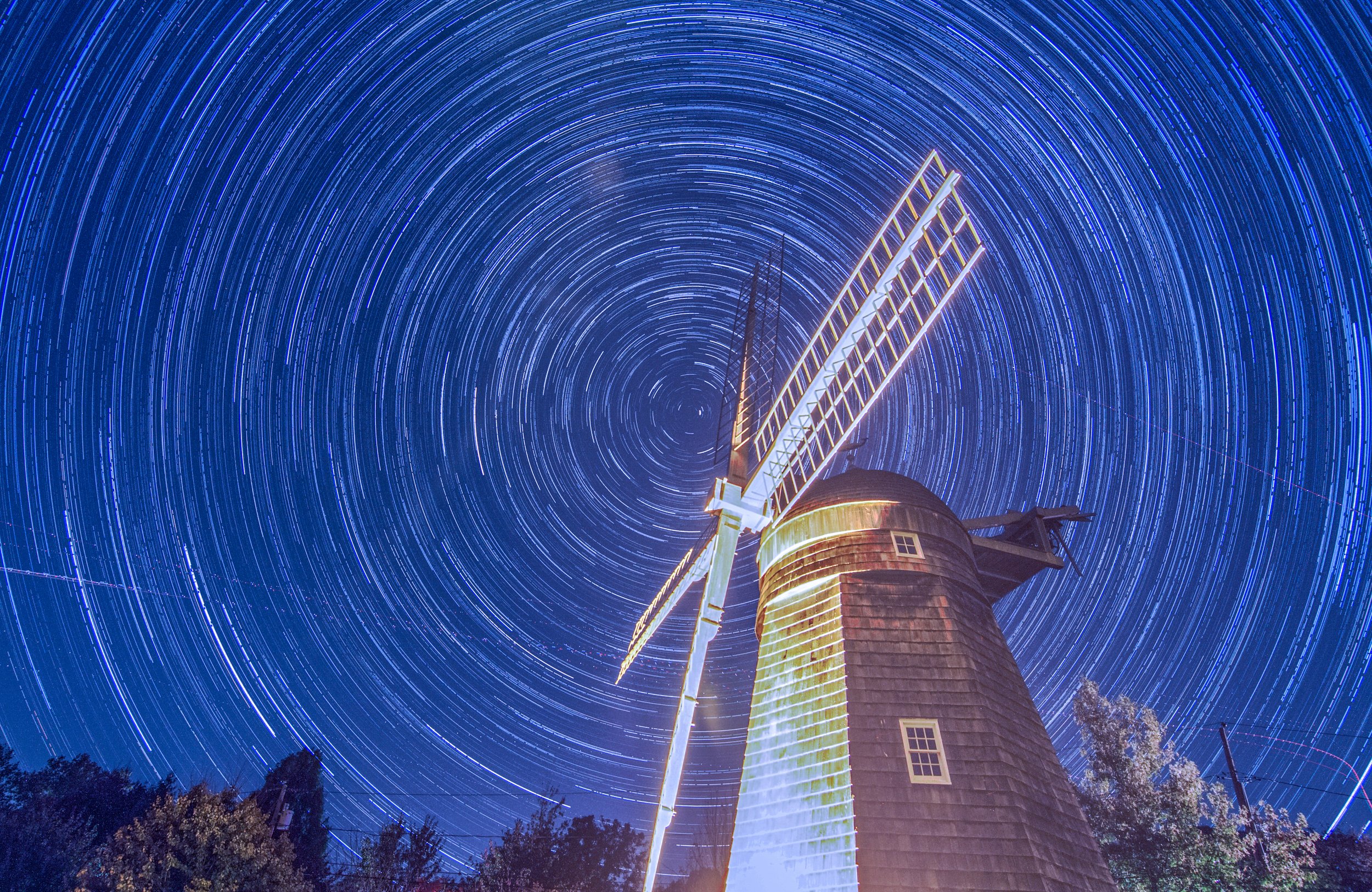 Winds of Time
Built in 1820, the historic Beebe Windmill in Bridgehampton stands preserved under a clear, star-lit sky. As one of the few remaining Long Island windmills with its original internal machinery, it represents two centuries of agrarian hi