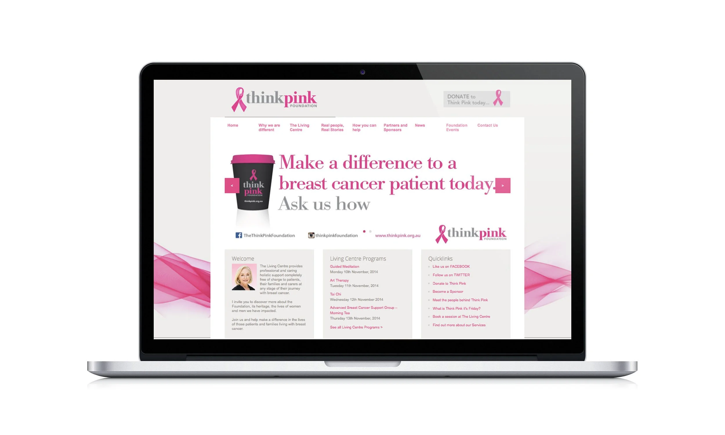 Laptop displaying the homepage of the Think Pink Foundation website, promoting breast cancer awareness and support, with pink ribbons and related information.