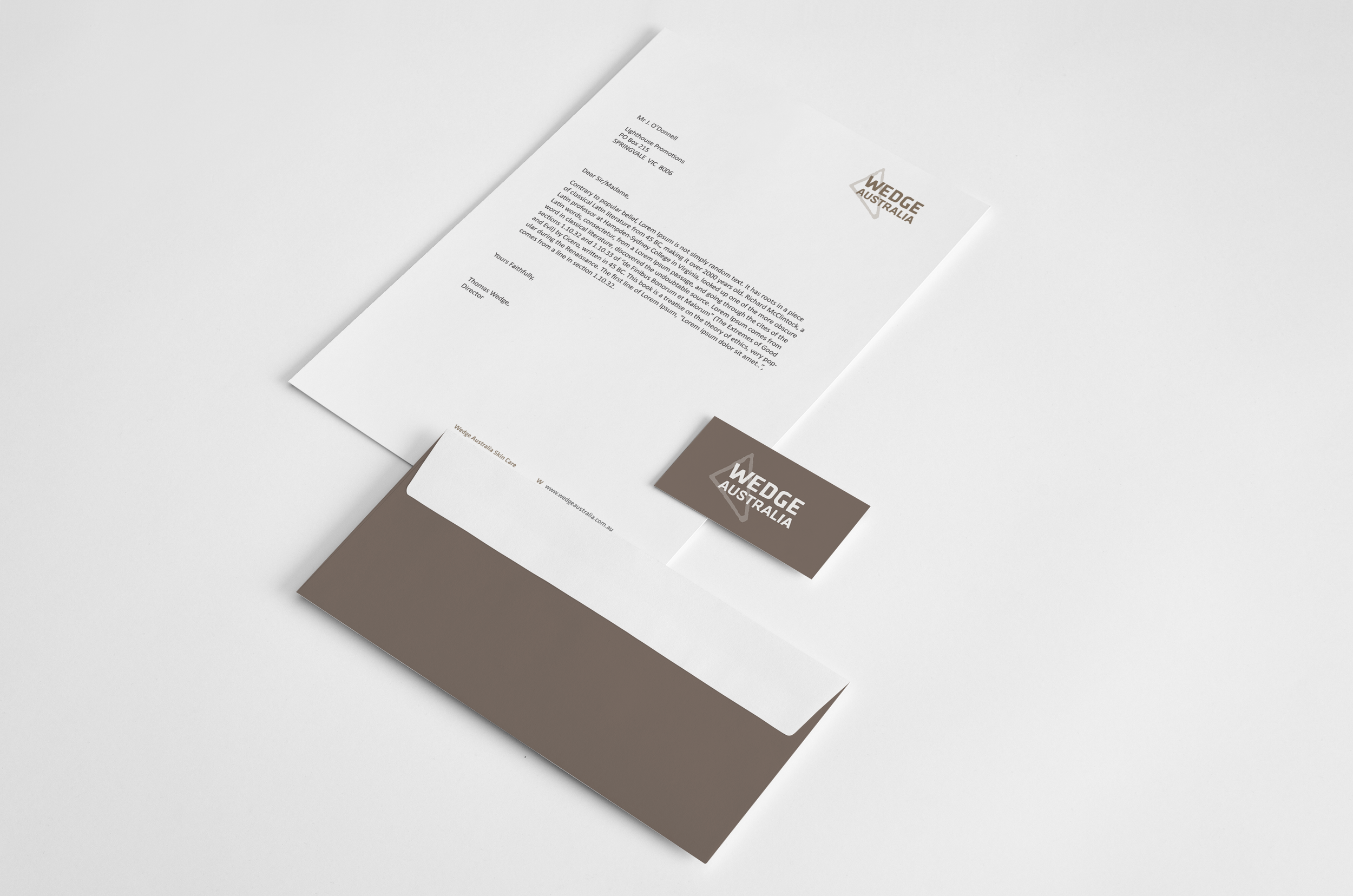 Letter and business card from Wedge Australia on white background.
