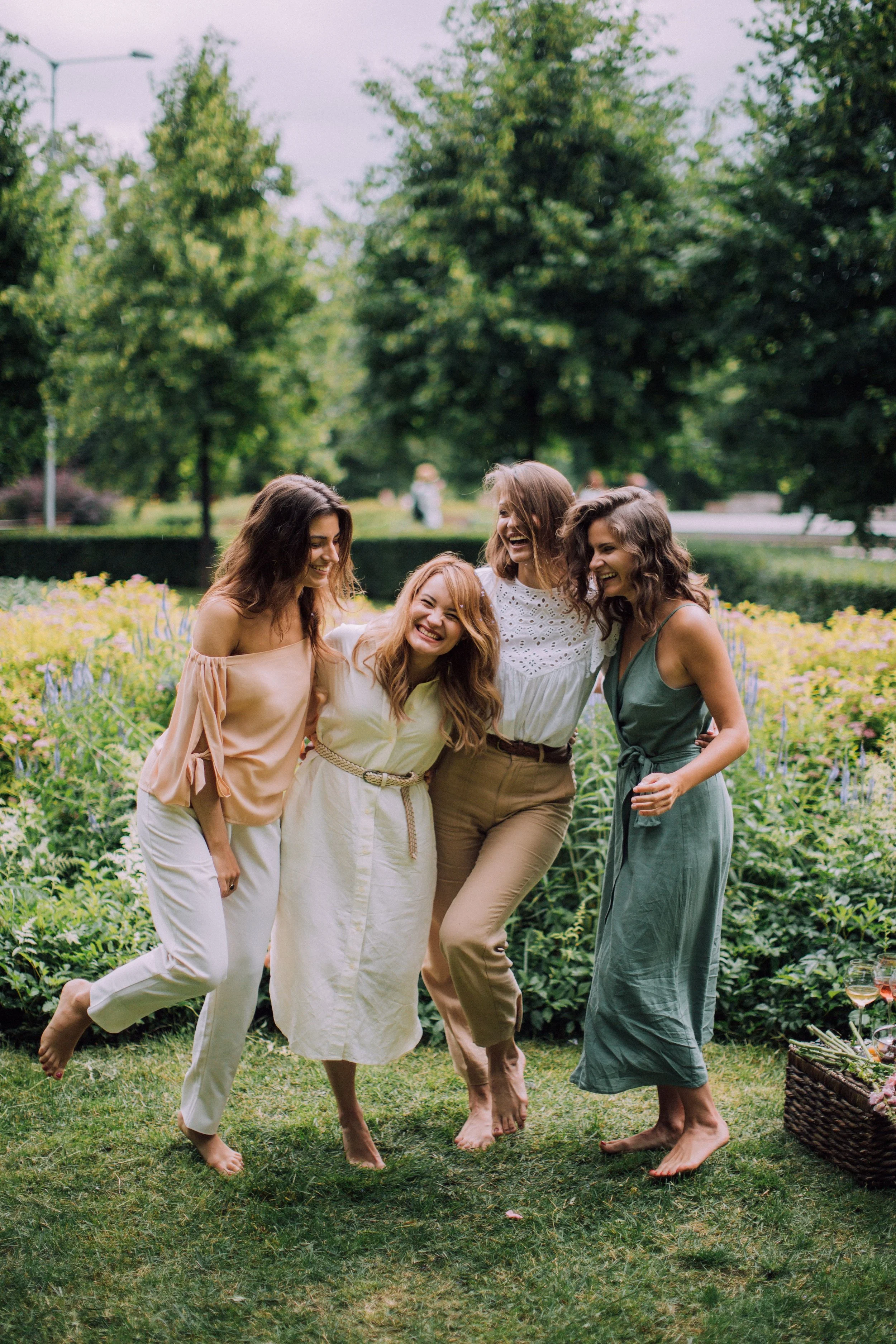 Four women walking together outdoors