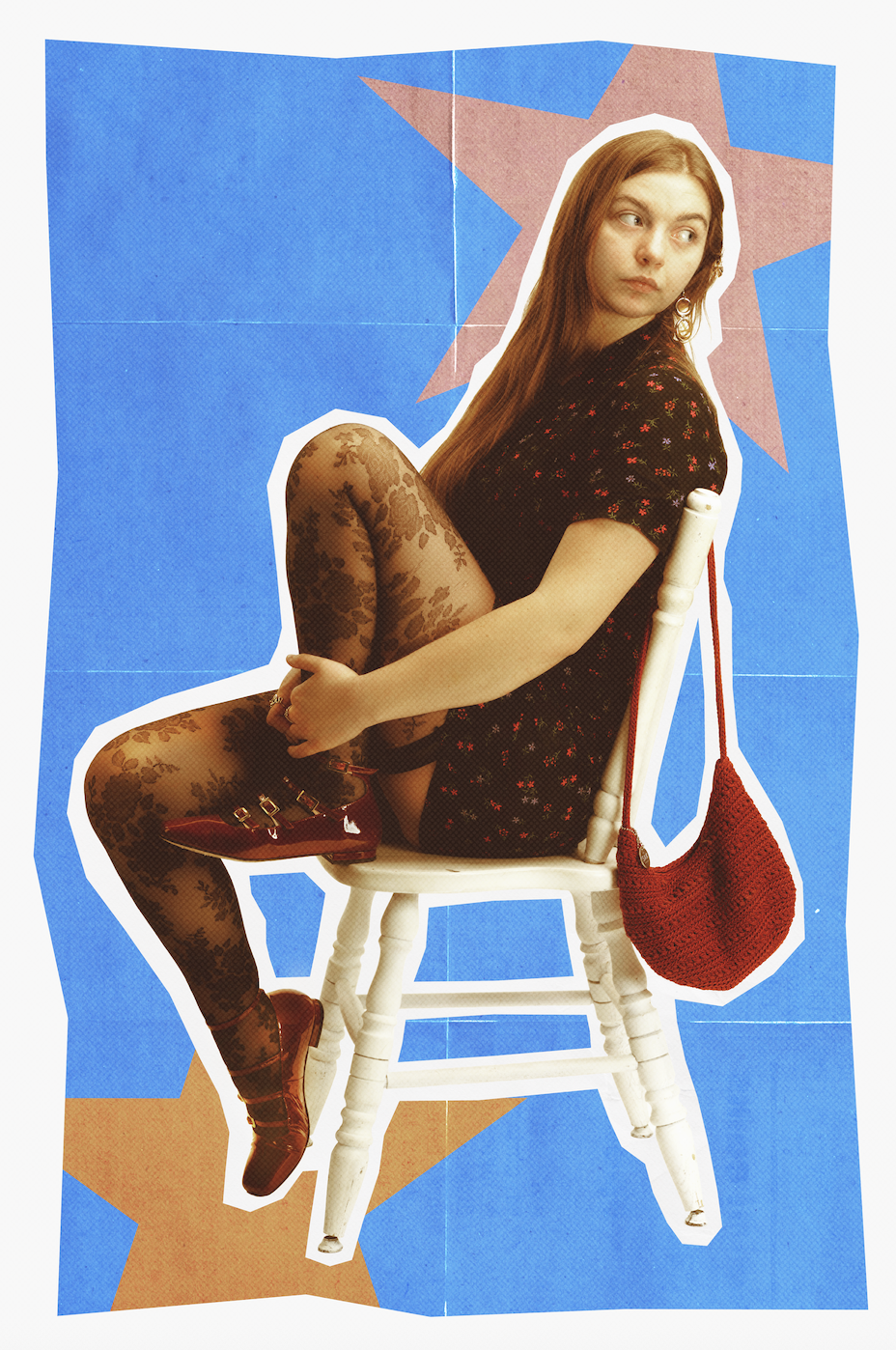A young woman with long red hair sitting on a white wooden chair, wearing a black floral dress, patterned tights, and red shoes, with a red knit bag hanging on the chair. The background features blue space with pink stars and a collage-like design.