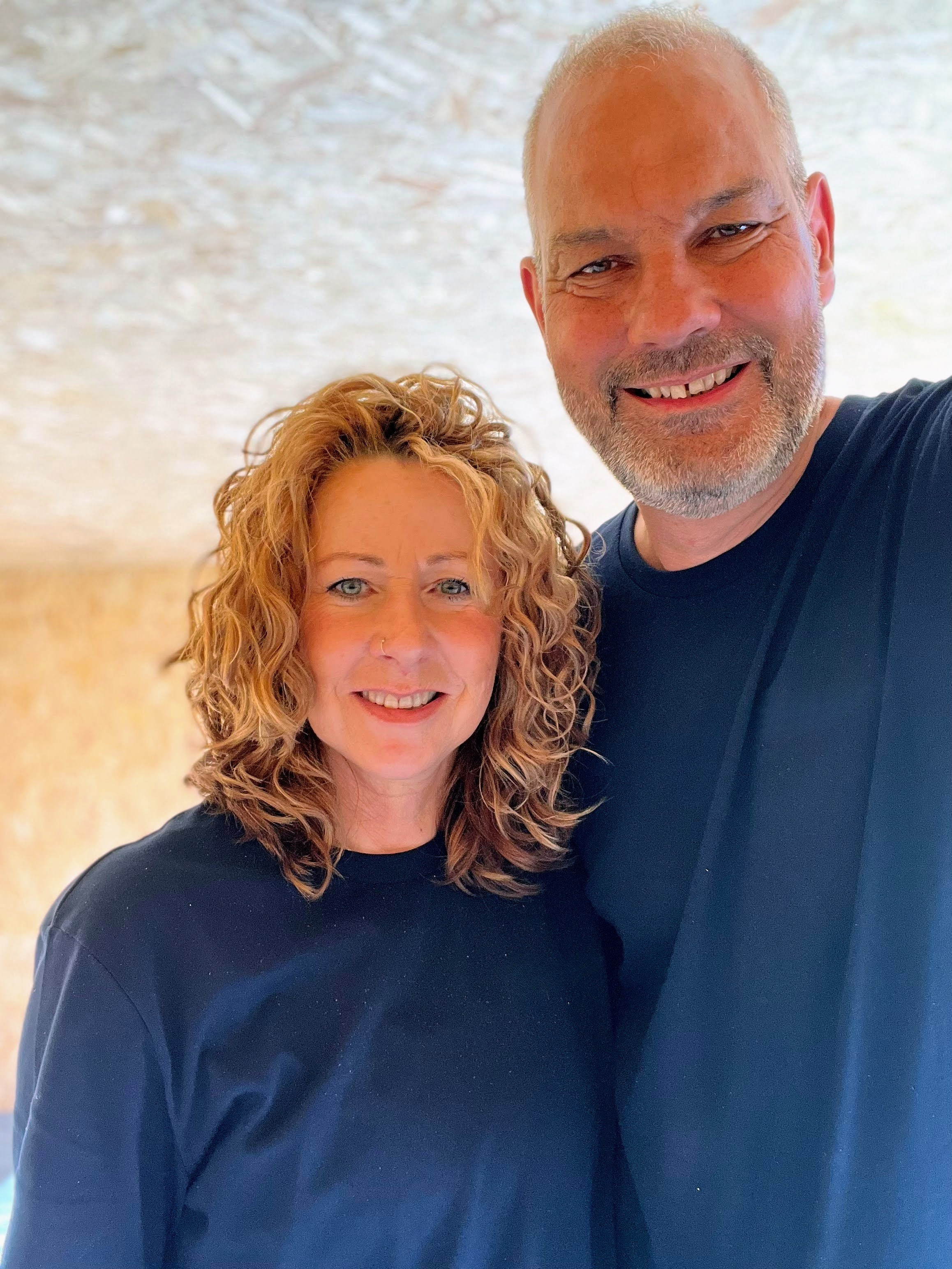 A picture of Simon and Angie together against a neutral background