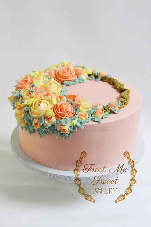 pink+with+wreath+and+florals+buttercream.webp