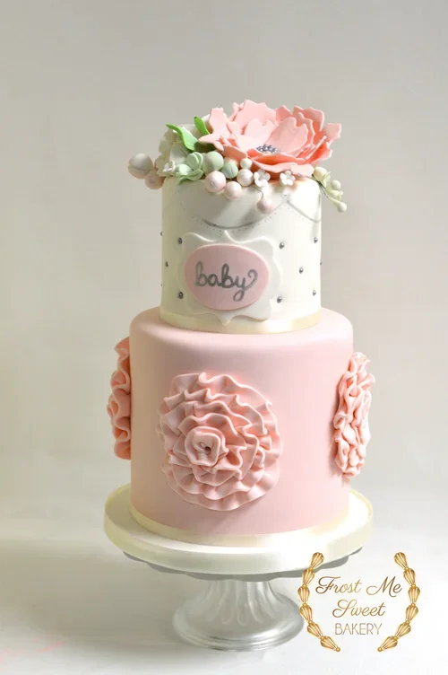 pink+rosette+and+white+with+fondant+flowers+pumpkin+baby+shower+cake.webp