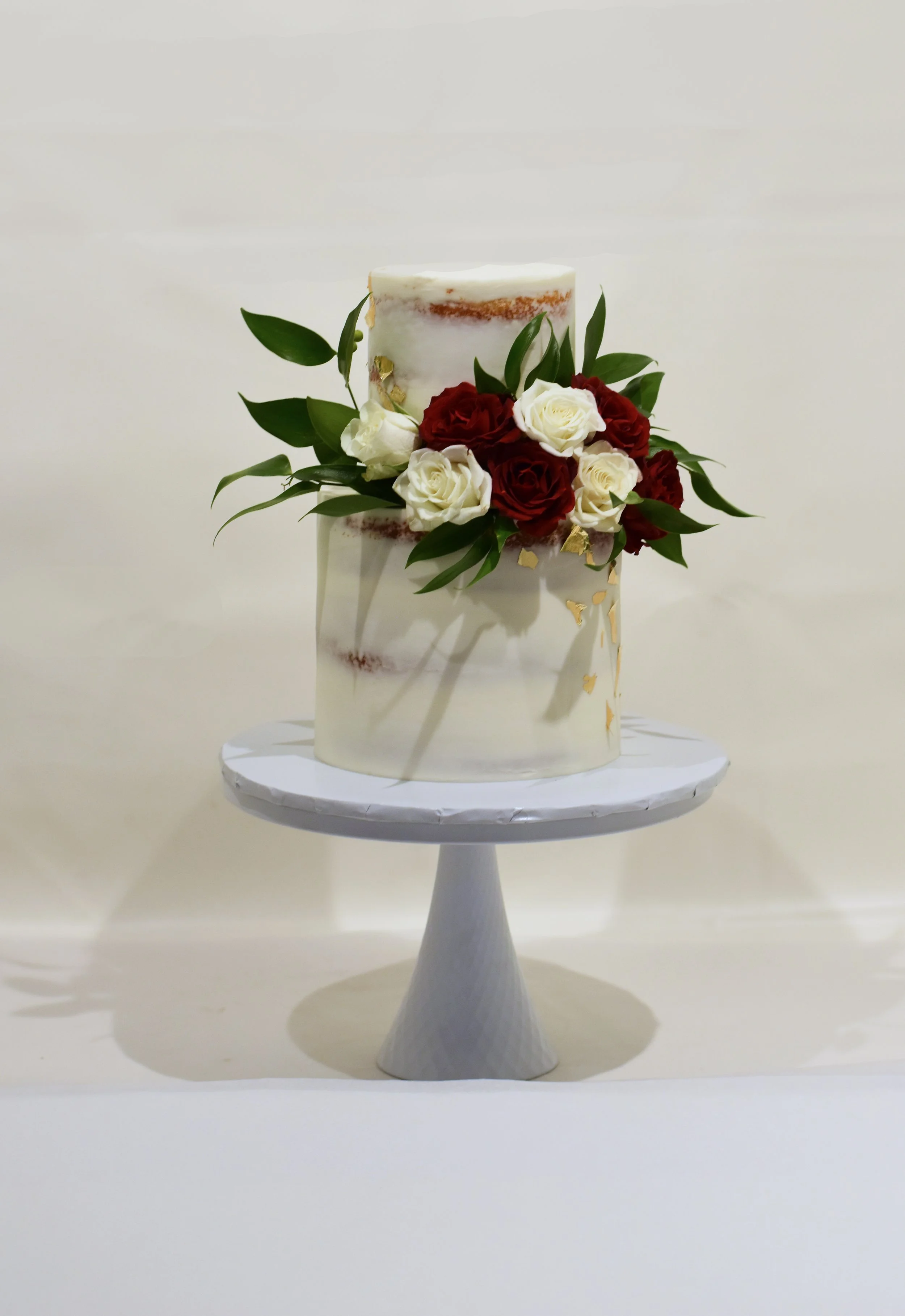 2 tier semi naked with roses.jpg