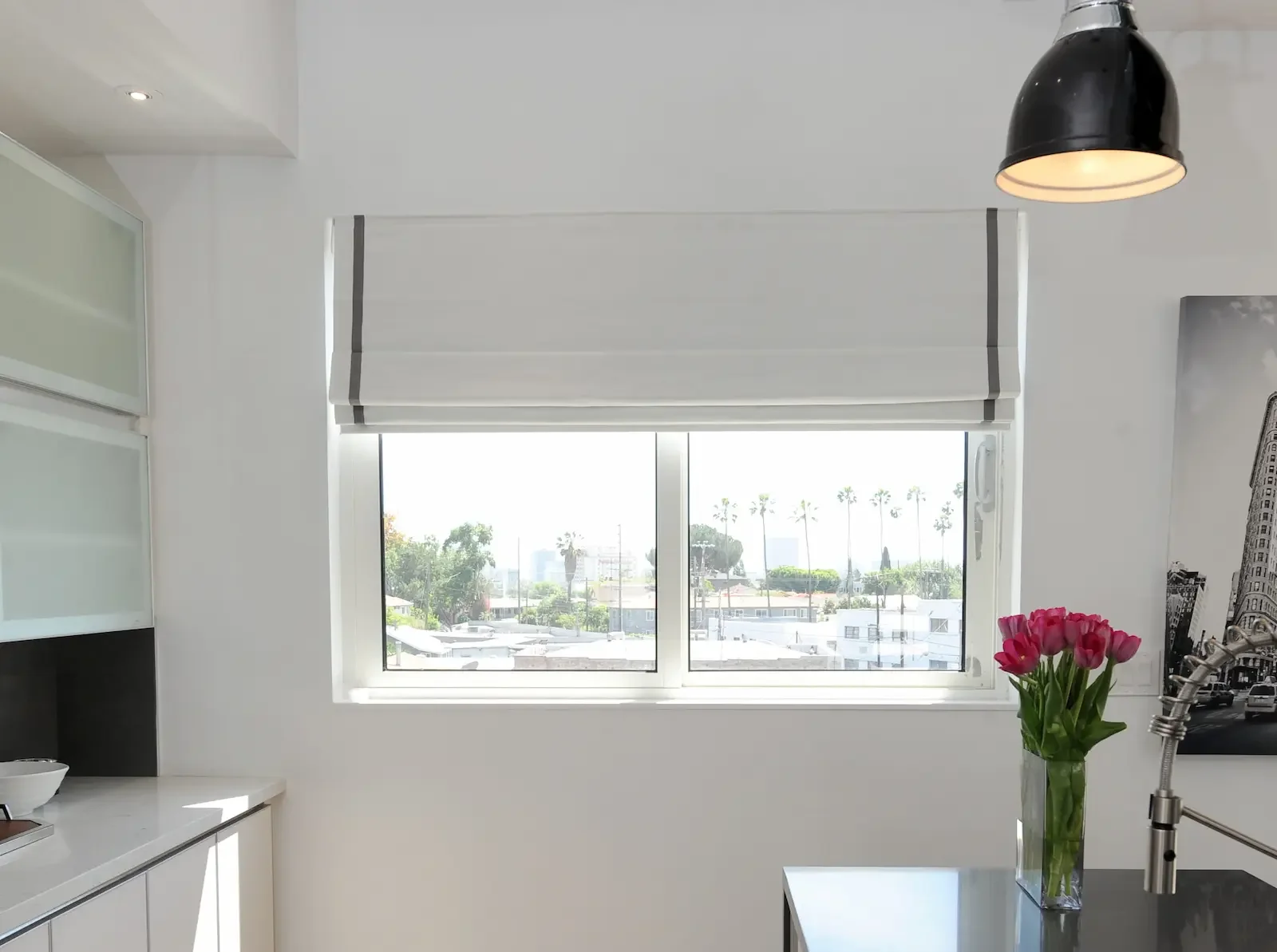 Tailored Roman shades mounted inside the window frame for a clean look