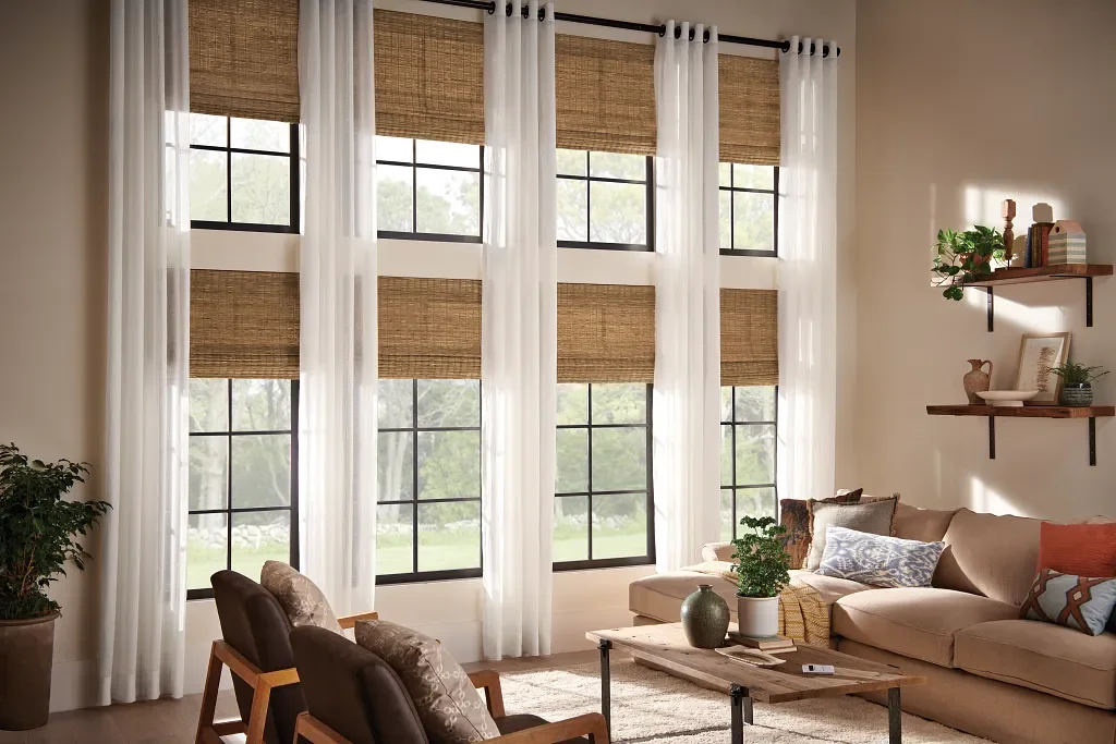 Simple, sheer drapery panels to frame windows with textured natural shades