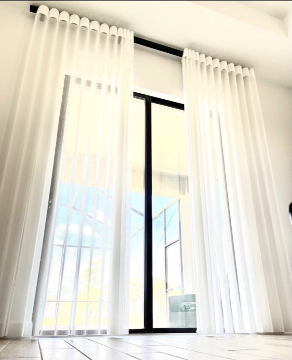 SmartDrape sheer vertical shades installed over sliding glass doors in a Nashville living room