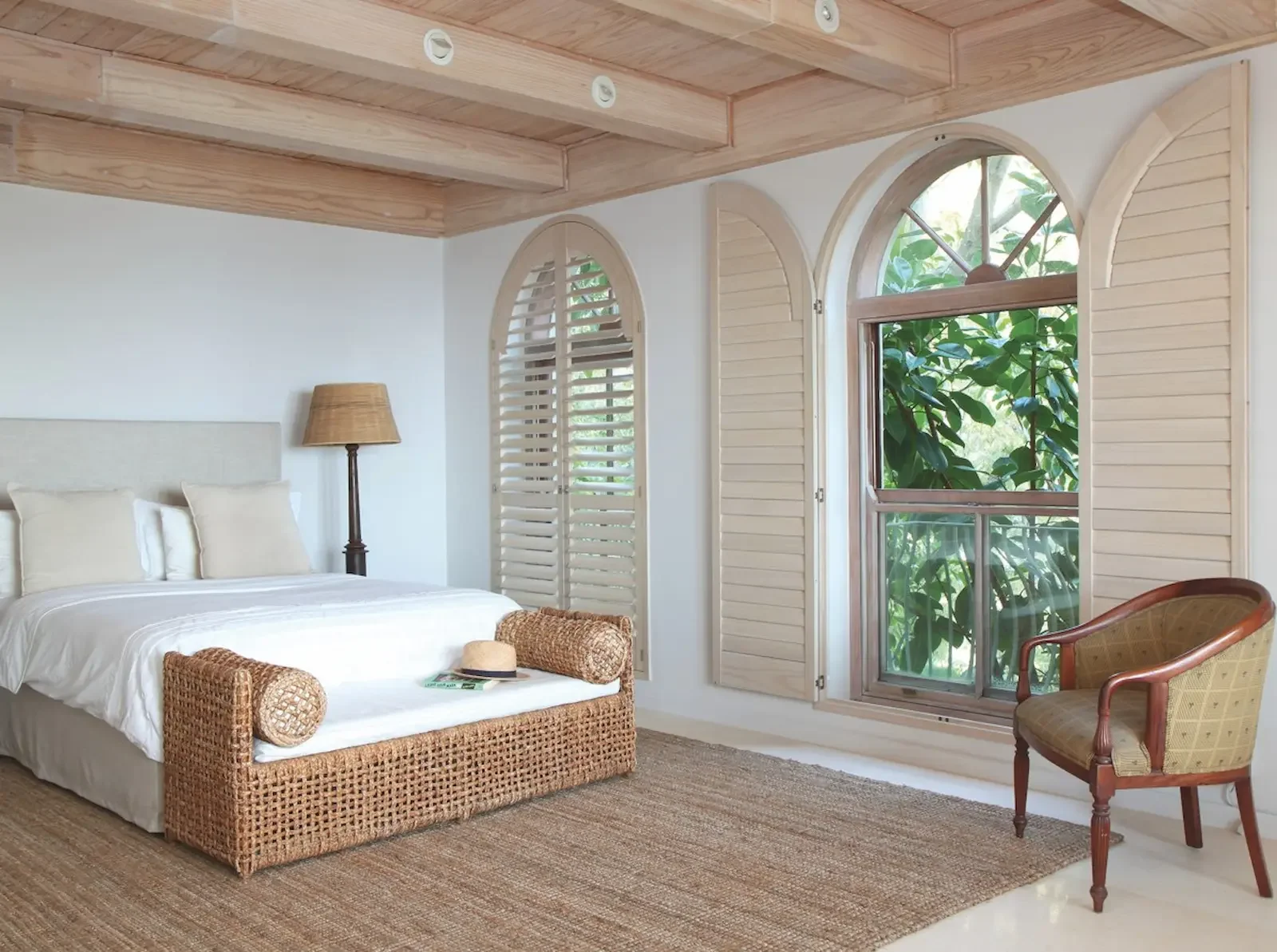 Norman arch shutter panels with a natural wood finish