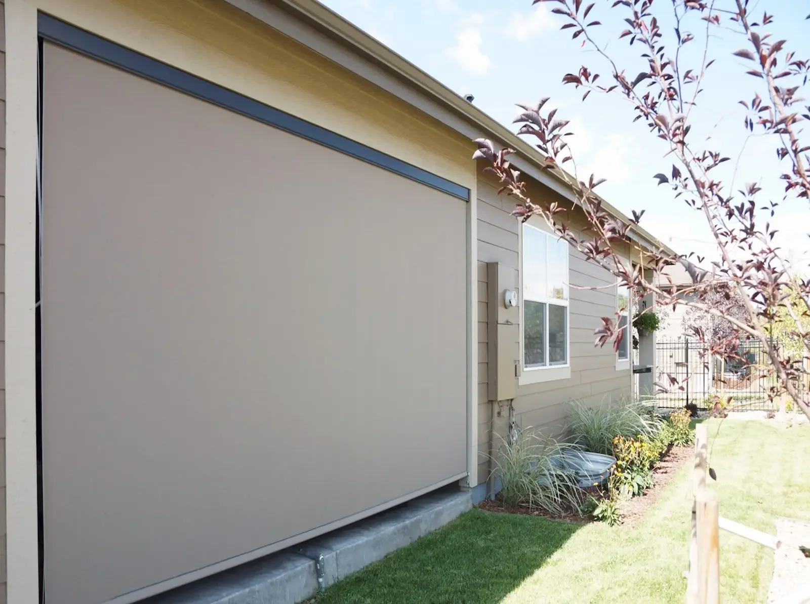 One large exterior solar shade transformed this open porch to a comfortable space to be used year round.