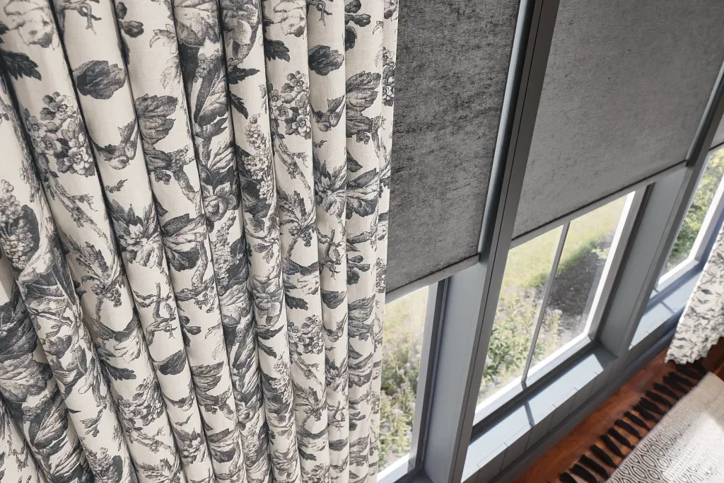 Roll pleat / ripple fold draperies with coordinated blackout roller shades