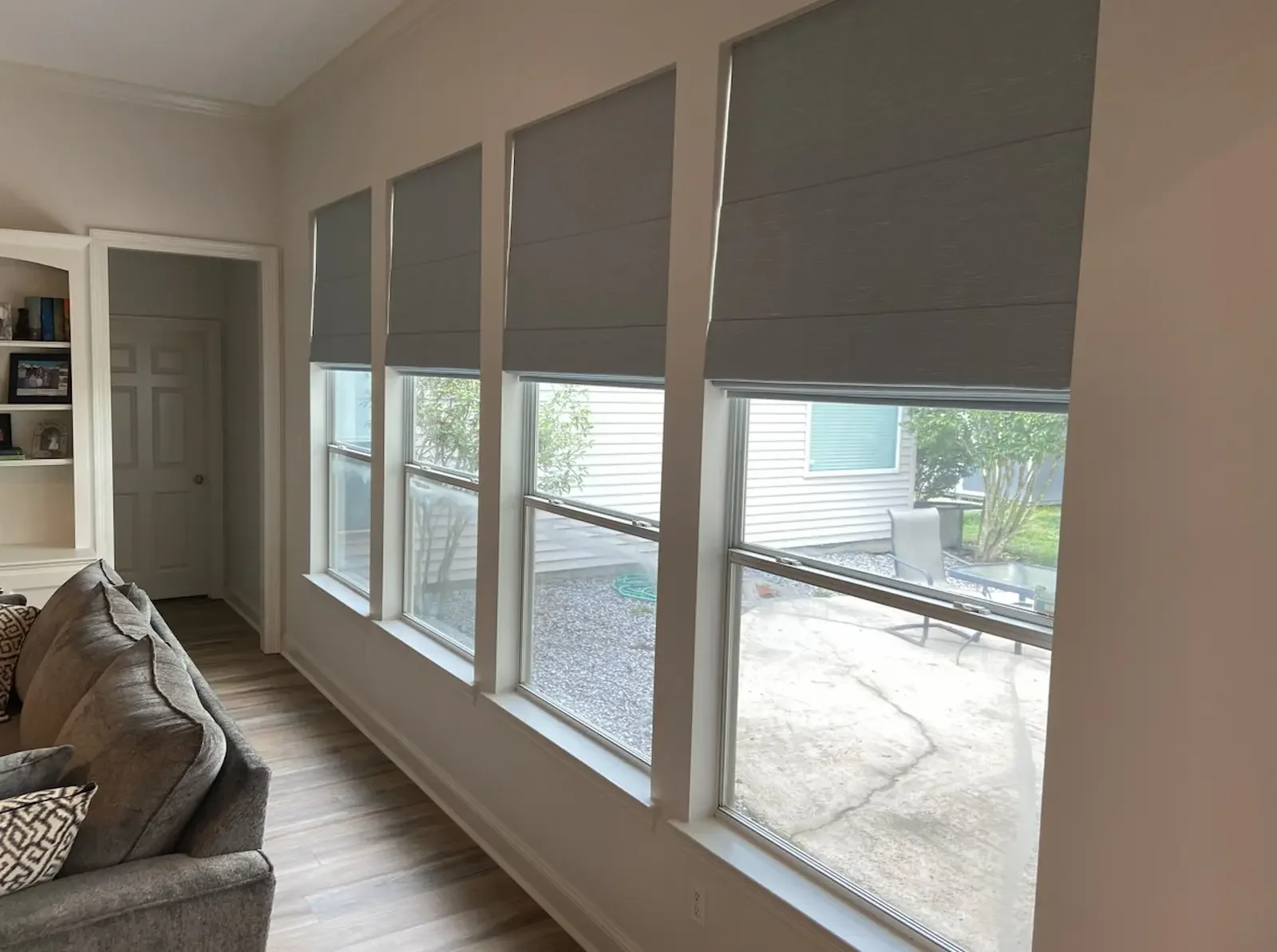 Custom Roman shades installed on side-by-side windows in a Nashville home