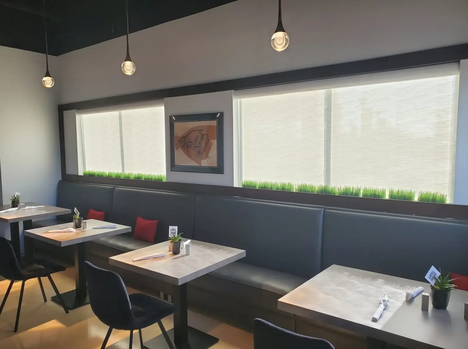 5% openness solar shades reducing glare in a diner