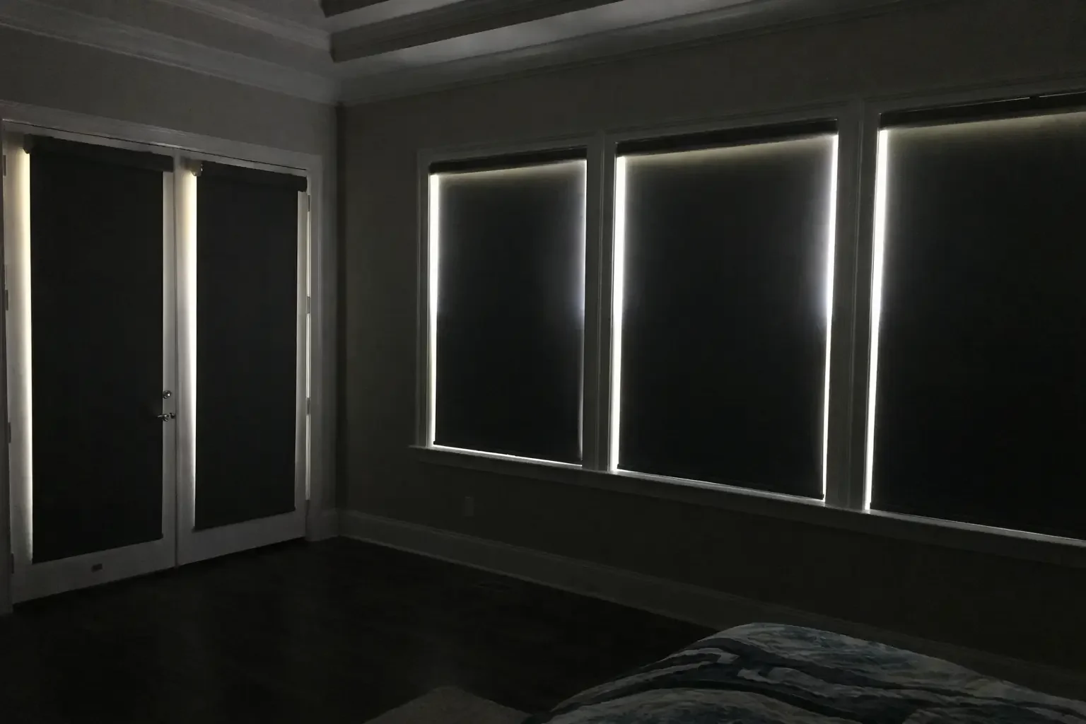 Blackout shades with no tracks that still allow light around the perimeter. This is not a full blackout solution.