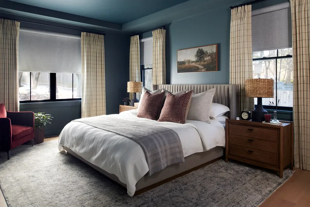 Layered draperies and shades can create a room full of light or a blackout retreat.