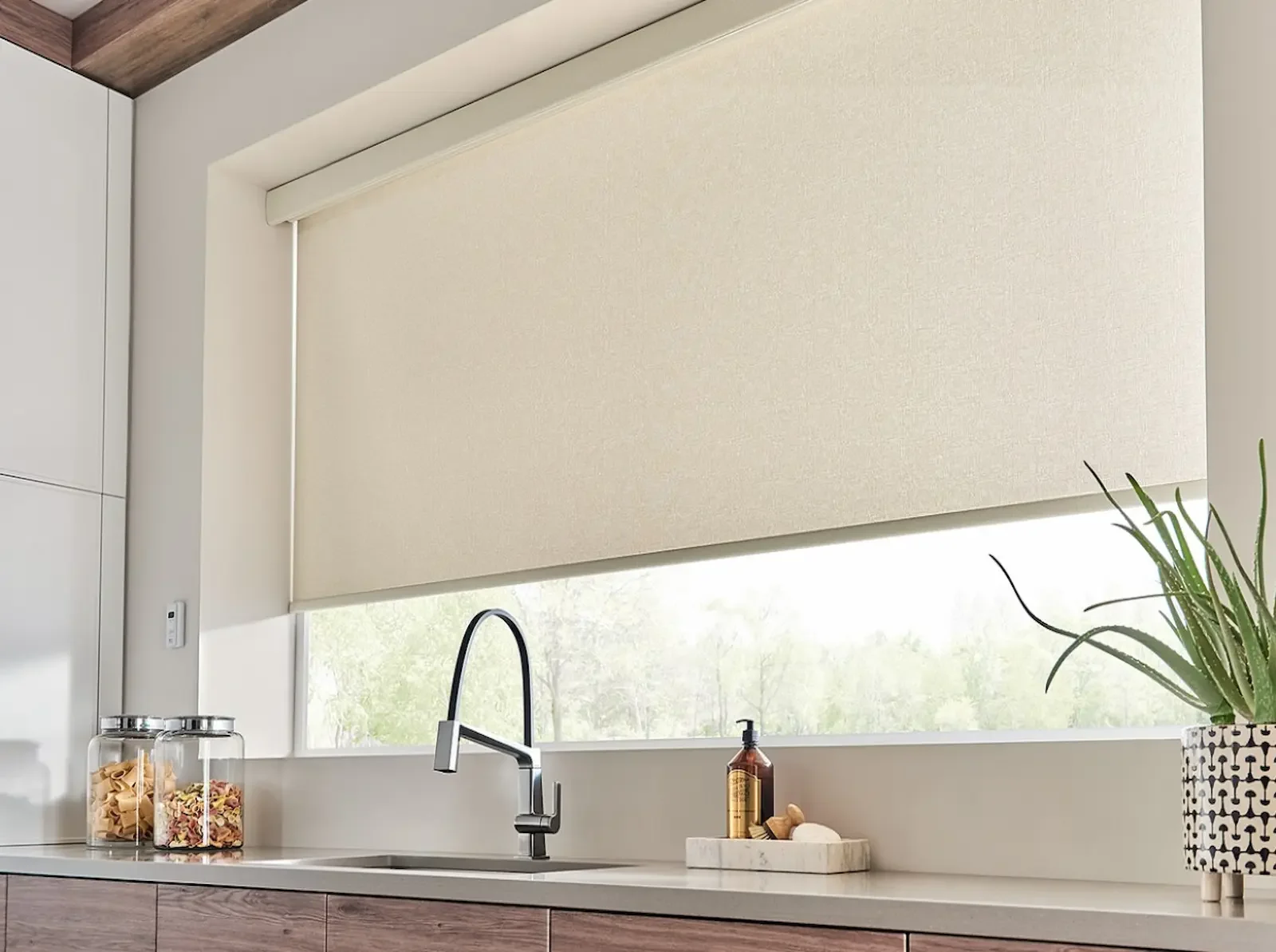 Designer textured roller shades installed in a Brentwood kitchen