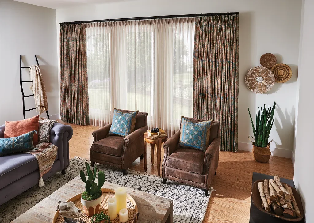 Draperies framing a large sliding door with sheers