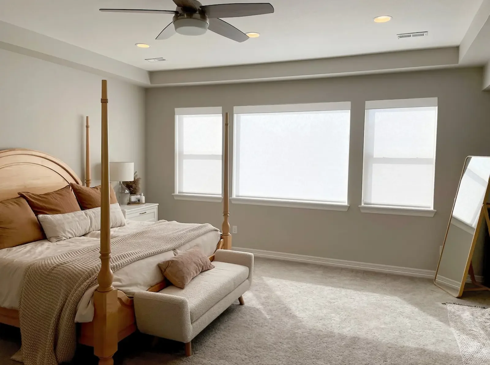 Motorized roller shades integrated with home automation in a new construction home