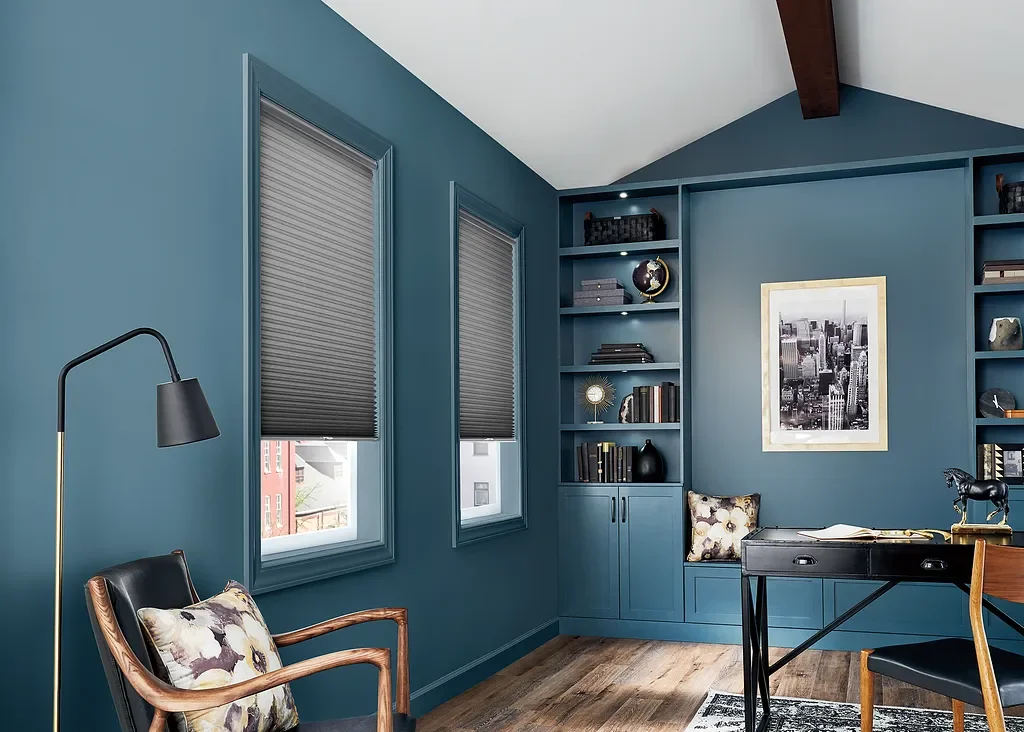 Cellular shades reducing glare in a home office