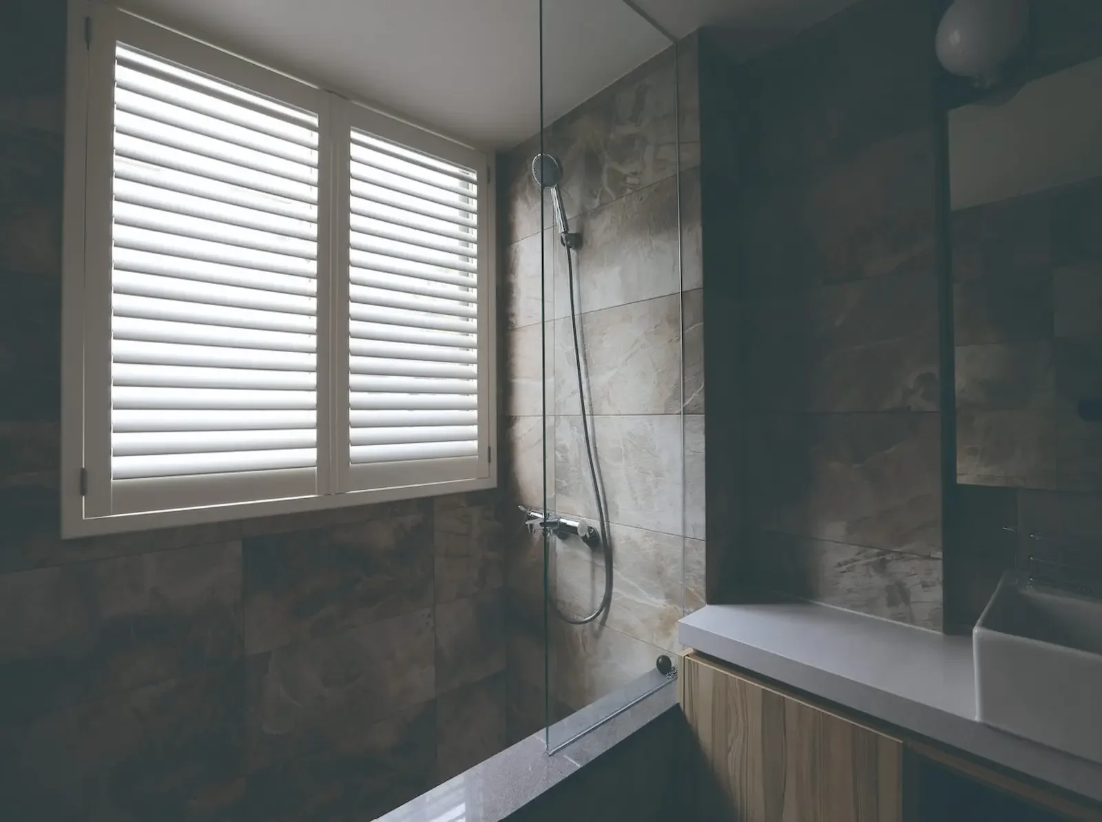 Waterproof shutters installed directly in a shower