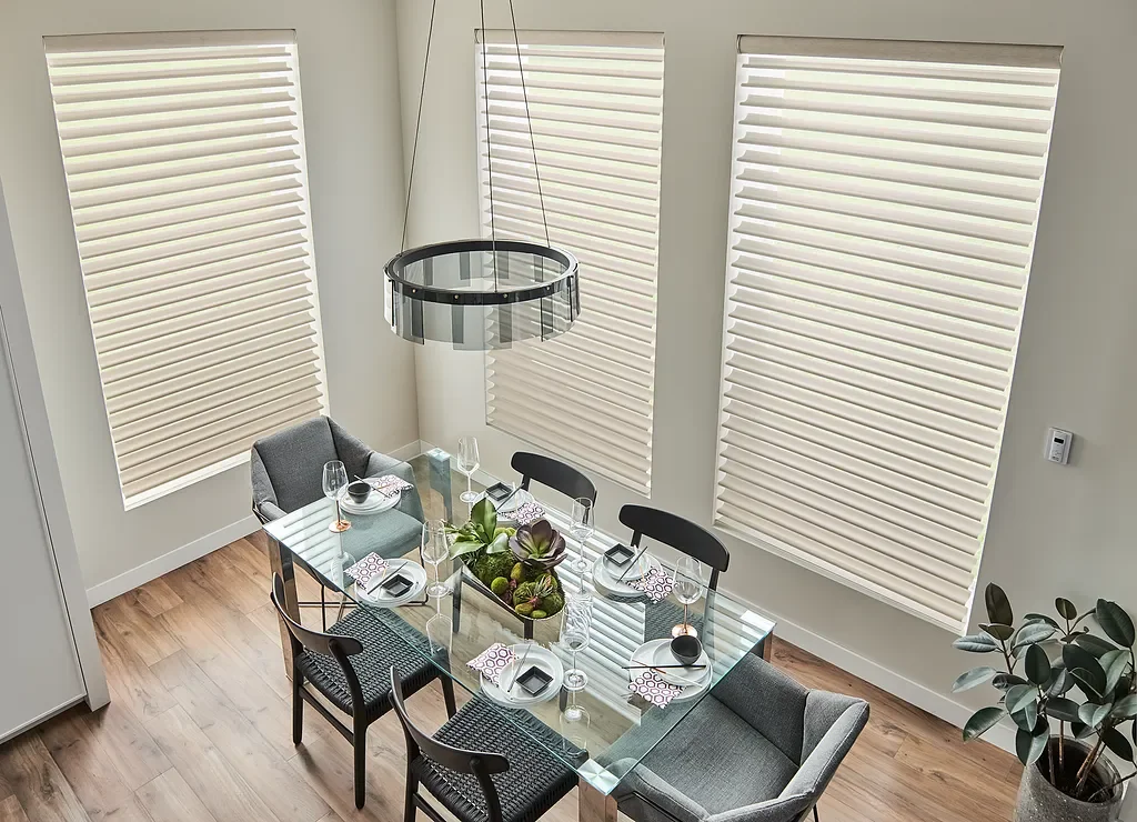 Graber sheer shades installed on tall dining windows to soften direct sunlight