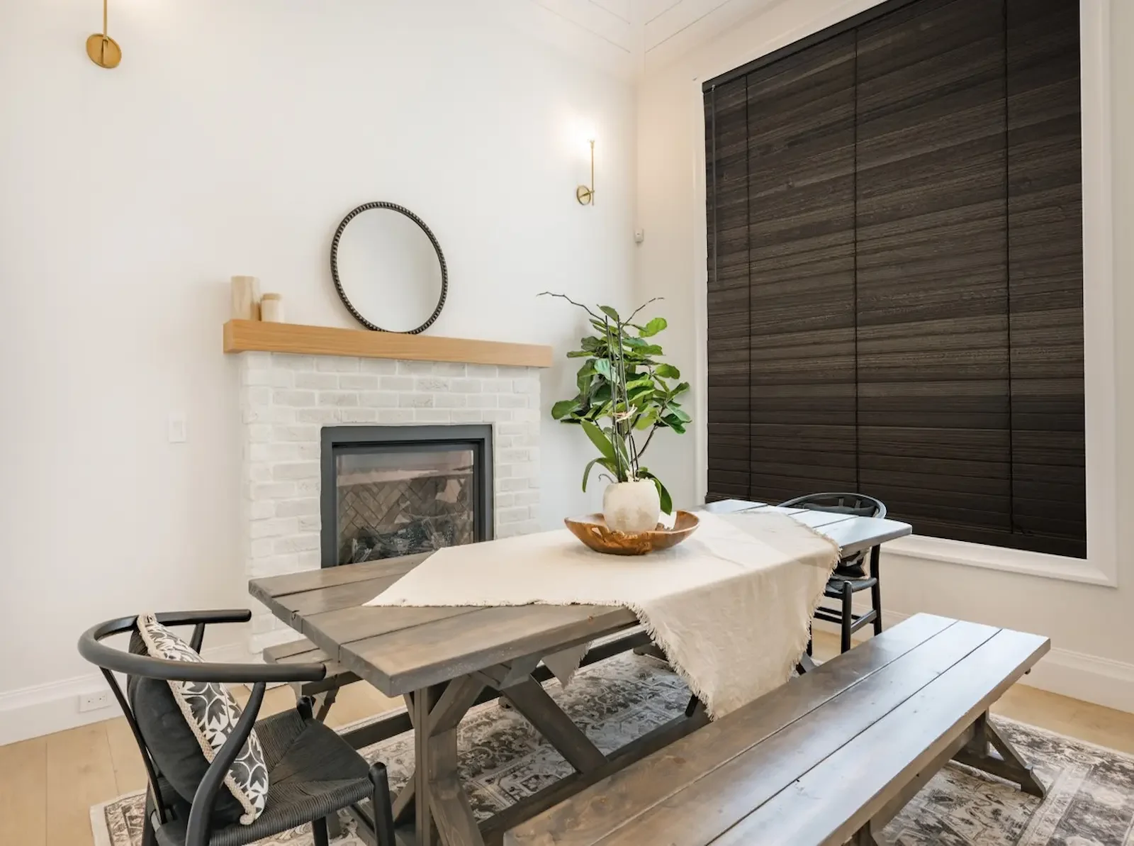 Stained wood blinds with wide slats in a dining room