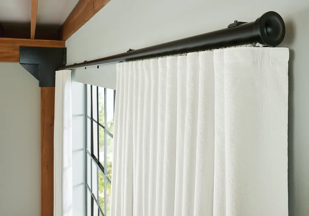 White roll pleat / ripple fold draperies with simple black rod