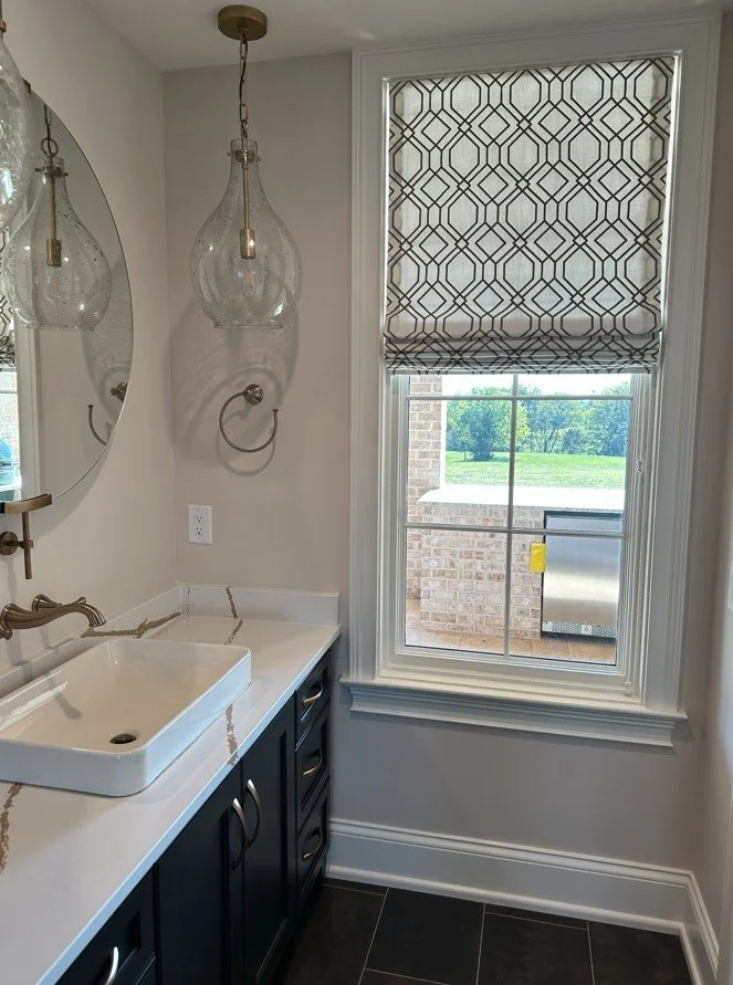 Patterned Roman shade adding the proper touch to a Franklin bathroom