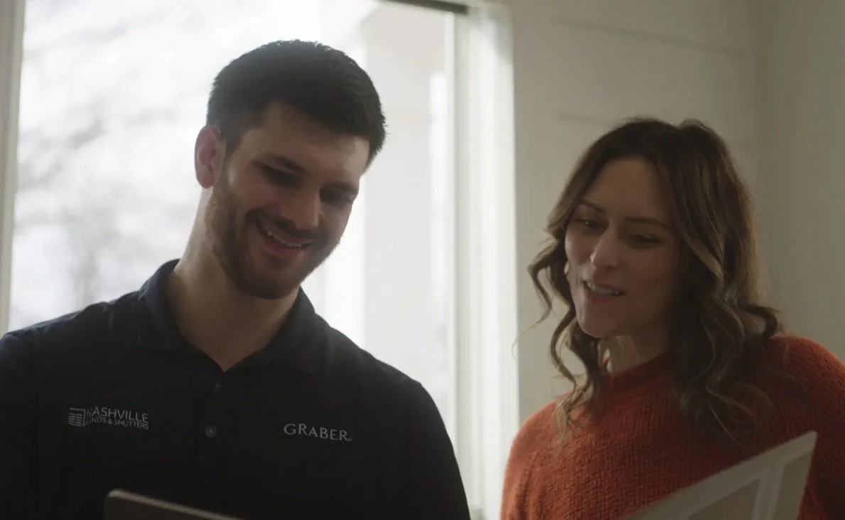 Nashville Blinds & Shutters sales consultant discussing an estimate and selections with a customer.