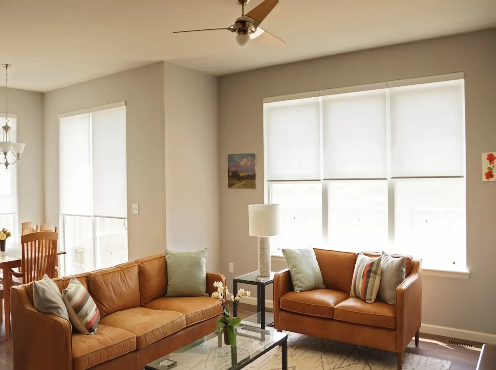 Light-filtering roller shades partially lowered in a Nashville living room