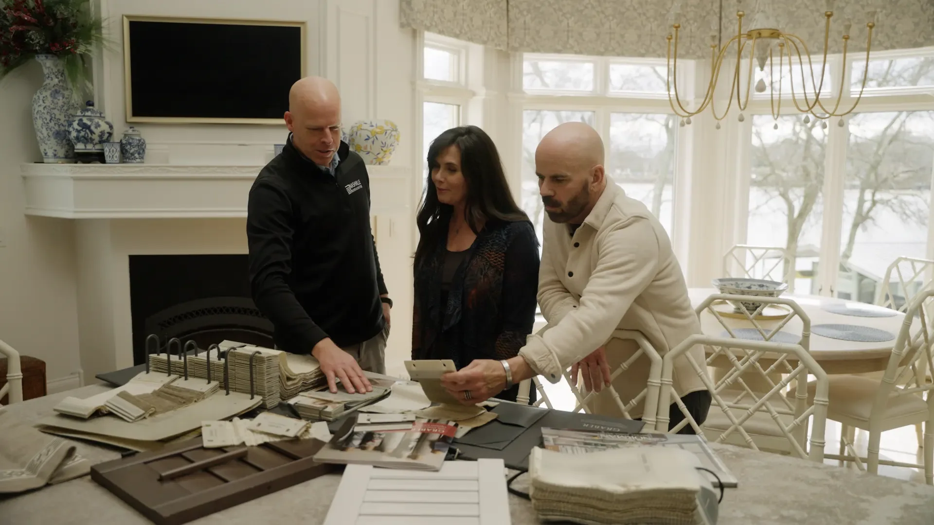 Homeowners meeting with a Nashville Blinds & Shutters sales consultant and designer.