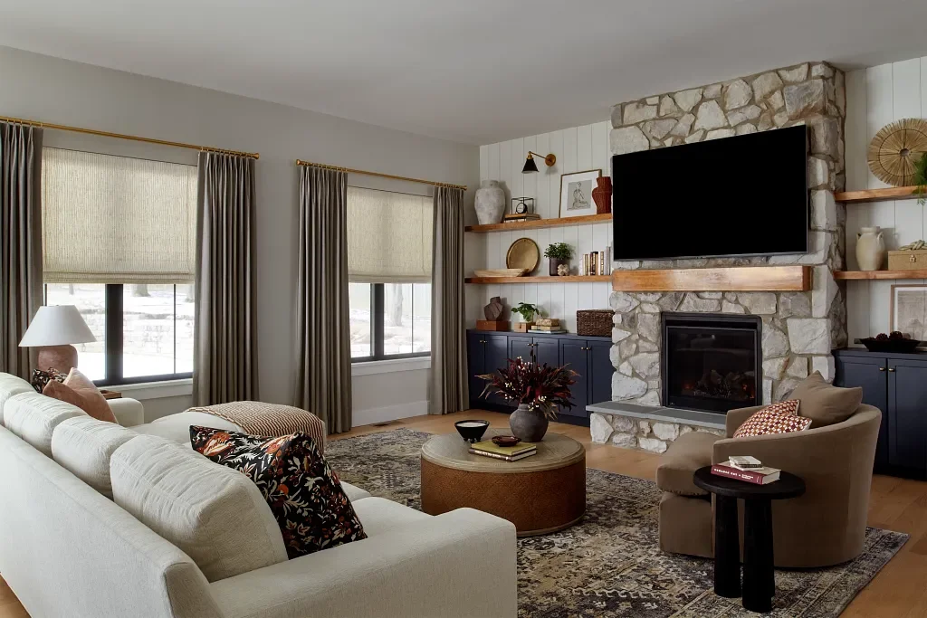 Two-finger inverted pleat draperies on rings in living room
