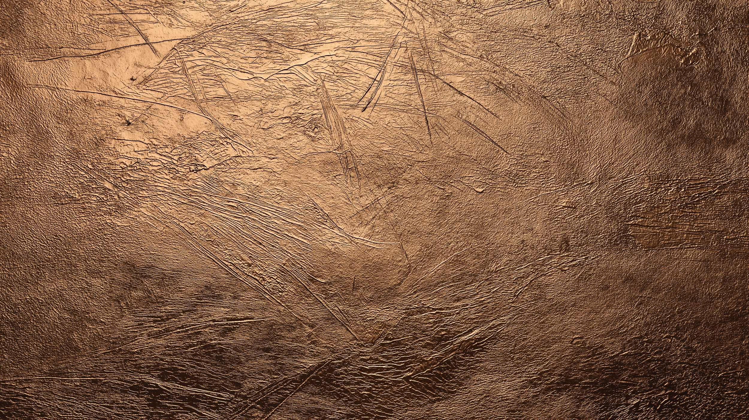 Close-up of brown leather surface with visible texture and scratches.